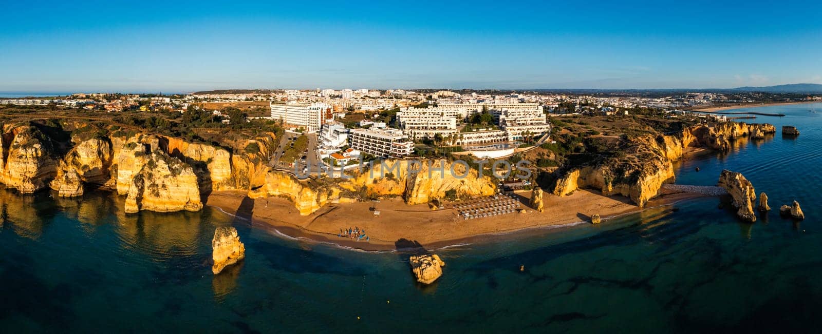 Praia de Dona Ana beach with turquoise sea water and cliffs, Portugal. Beautiful Dona Ana Beach (Praia Dona Ana) in Lagos, Algarve, Portugal. Praia de Dona Ana in Lagos in the Algarve, Portugal. by DaLiu