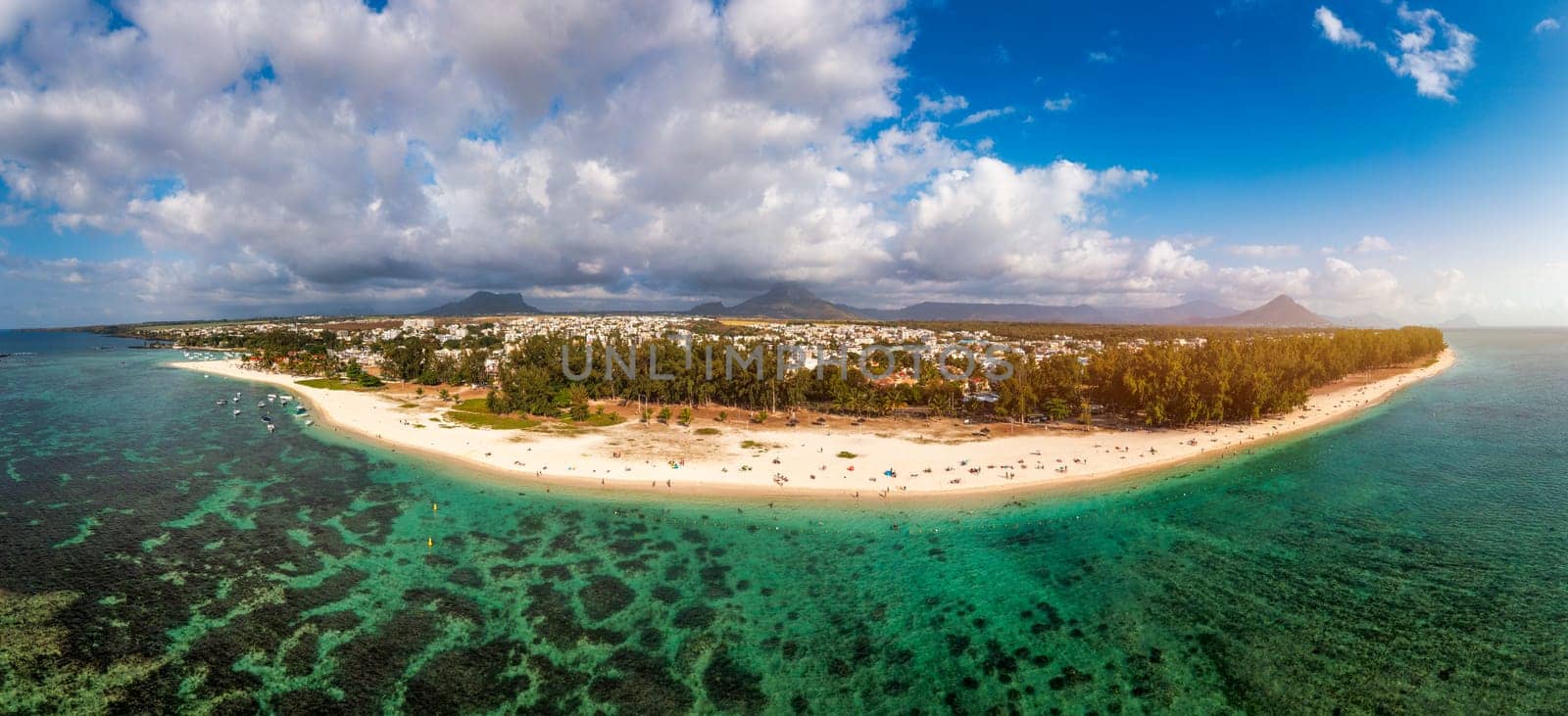 Beautiful Mauritius Island with gorgeous beach Flic en Flac, aerial view from drone. Mauritius, Black River, Flic-en-Flac view of oceanside village beach and luxurious hotel in summer. by DaLiu