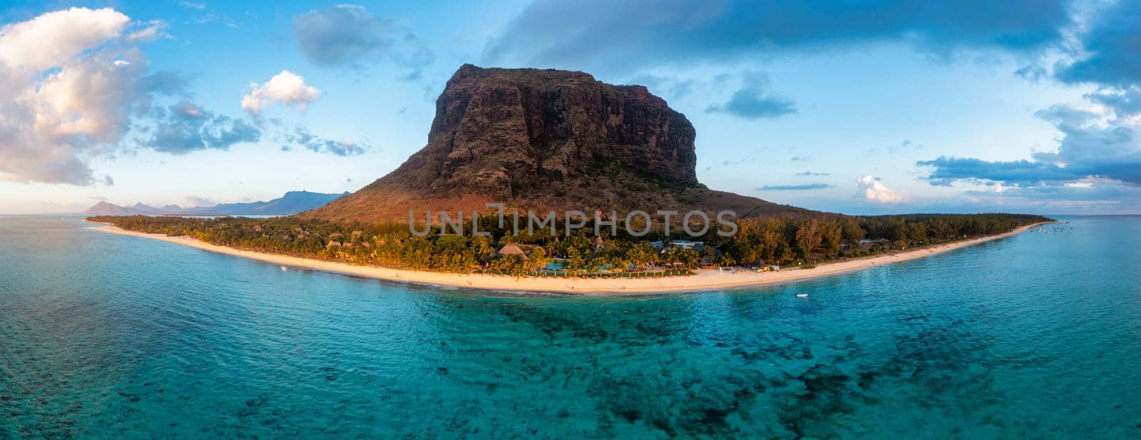 Aerial view of Le morne Brabant in Mauriutius. Tropical crystal ocean with Le Morne mountain and luxury beach in Mauritius. Le Morne beach with palm trees, white sand and luxury resorts, Mauritius.