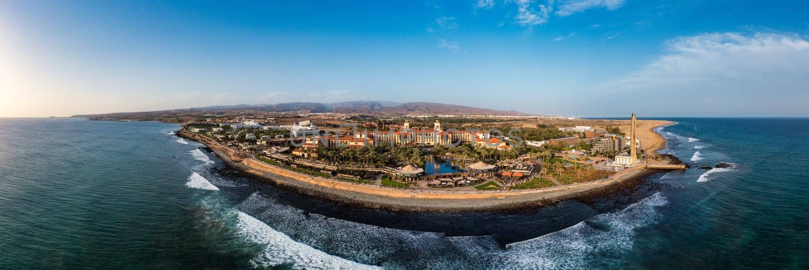 Aerial drone of the popular resort town of Meloneras, with hotels and restaurants, near the Maspalomas dunes in Gran Canaria, Canary Islands, Spain by DaLiu