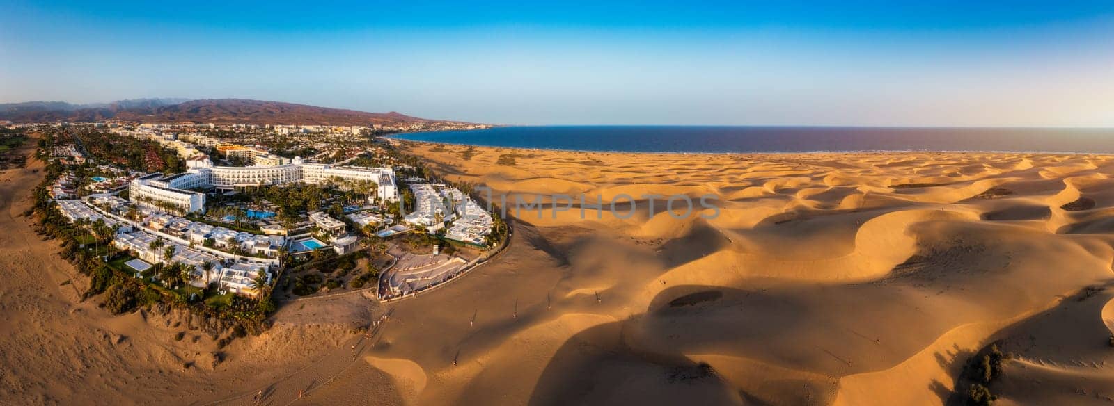 Landscape with Maspalomas town and golden sand dunes, Gran Canaria, Canary Islands, Spain. Natural Reserve of Dunes of Maspalomas, in Gran Canaria, Canary Islands, Spain.