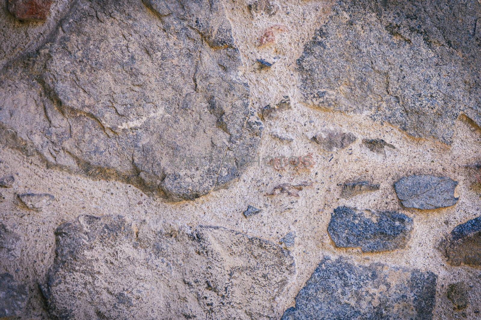 Full frame of a facade of a wall of stone constructed with volcanic rocks of origin 3