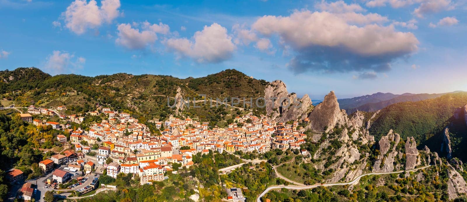 The picturesque village of Castelmezzano, province of Potenza, Basilicata, Italy. Cityscape aerial view of medieval city of Castelmazzano, Italy. Castelmezzano village in Apennines Dolomiti Lucane. by DaLiu