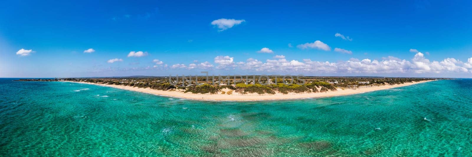 Punta Prosciutto azure sea water, crystal clear water on beach Punta Prosciutto, Italian Maldives Puglia Italy. Punta Prosciutto in Apulia, one of the most beautiful beaches of Italy.