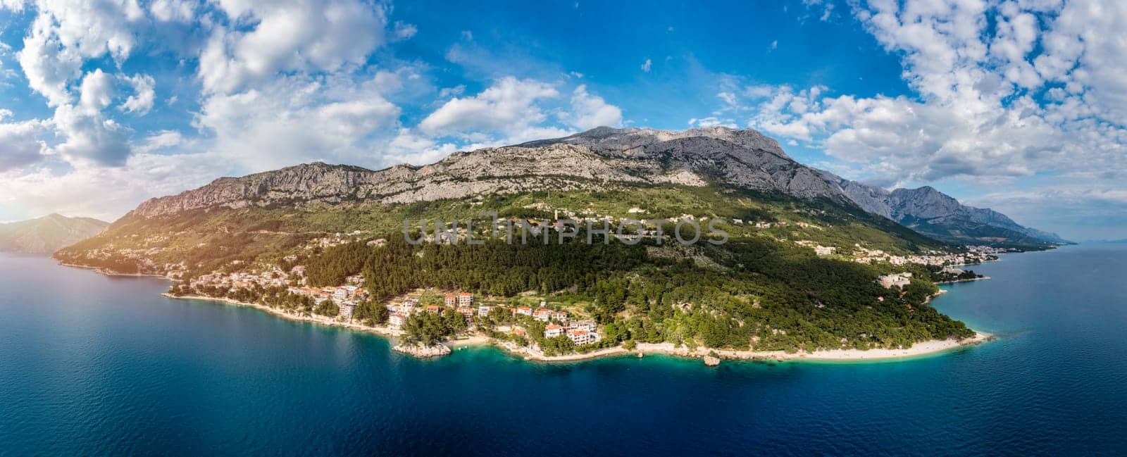 Beautiful aerial view of Punta Rata beach in Brela, Makarska Riviera, Croatia. Aerial view of Punta Rata beach and waterfront on Makarska riviera, Brela, Dalmatia region of Croatia. by DaLiu