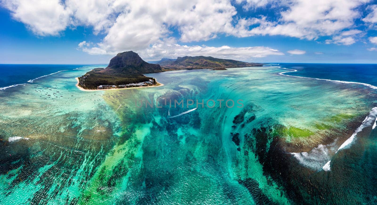 Aerial view of Mauritius island panorama and famous Le Morne Brabant mountain, beautiful blue lagoon and underwater waterfall. Le Morne Brabant peninsula and Underwater Waterfall, Mauritius. by DaLiu