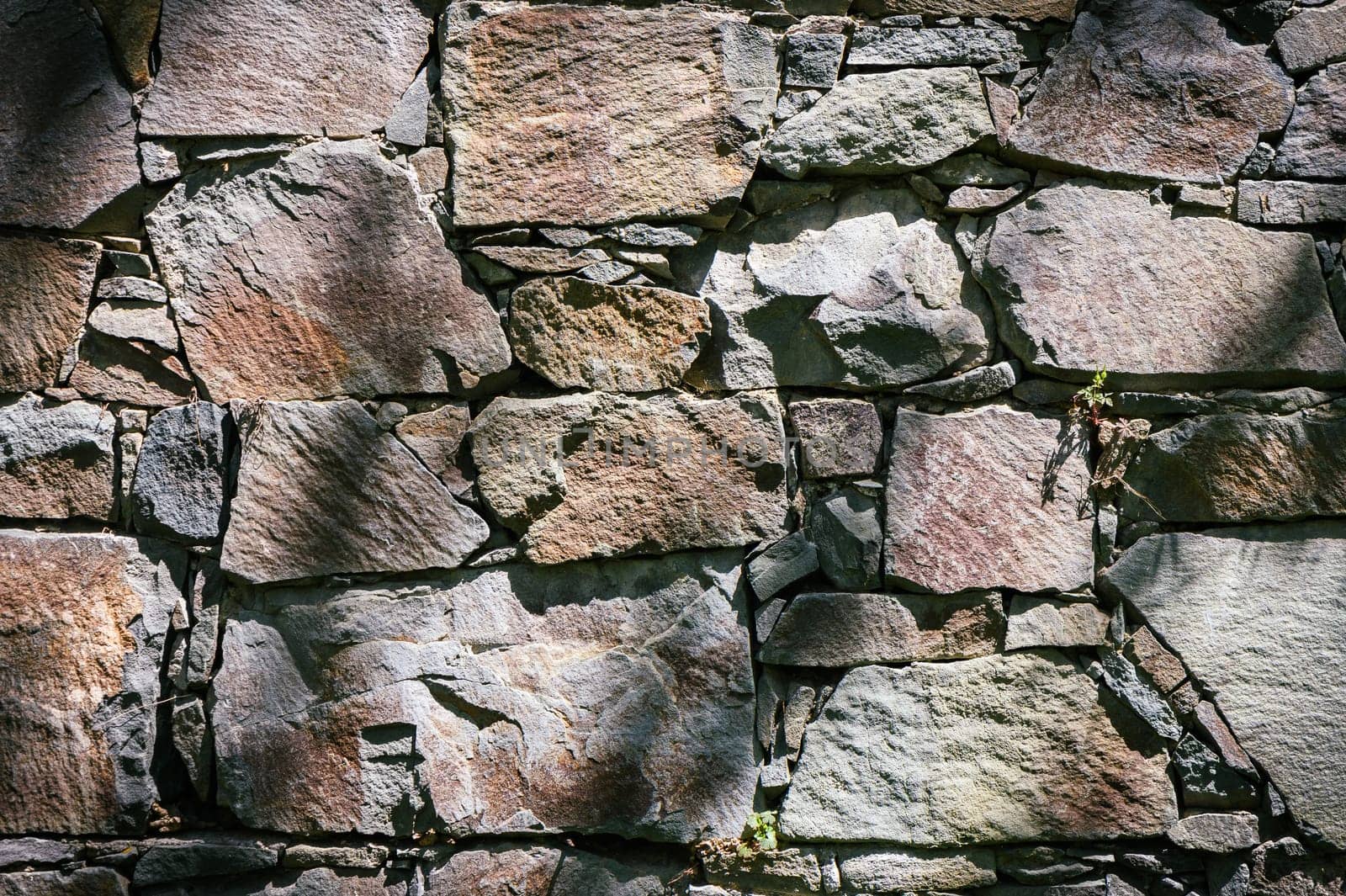 Full frame of a facade of a wall of stone constructed with volcanic rocks of origin 1