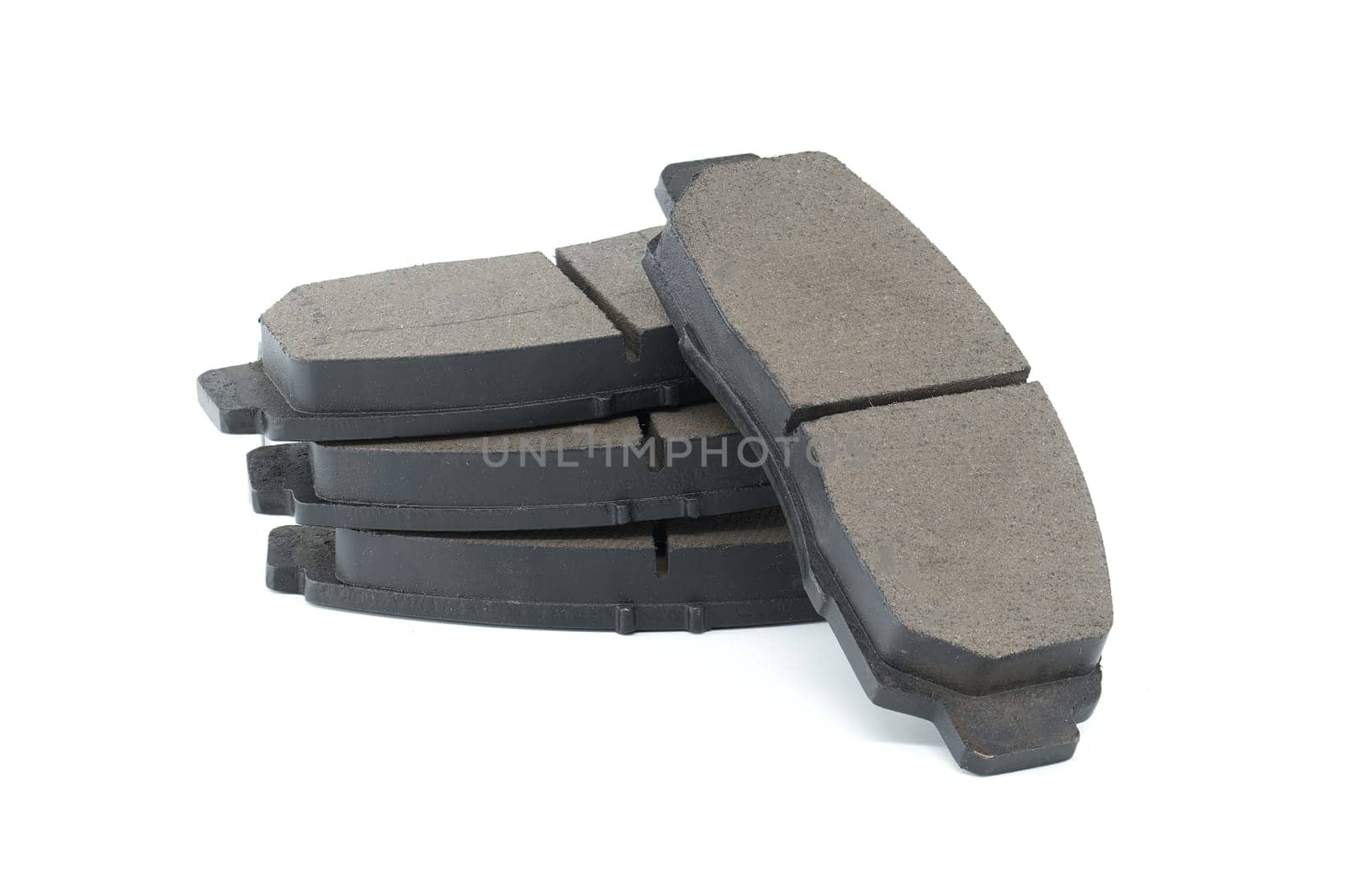 Set of auto brake pads isolated on white background, brake system maintenance, replacement parts for vehicle