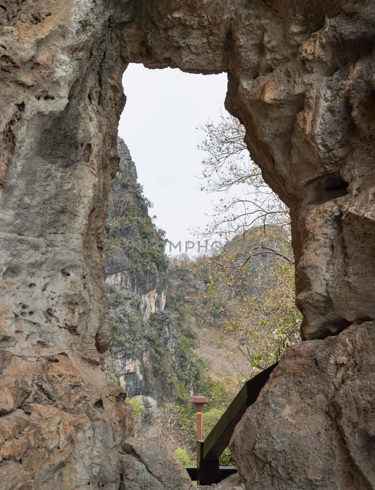 Beautiful scenery view of The Phanthurat's Mirror a small natural arch at Khao Nang Phanthurat Forest Park. Natural background, Space for text, Selective focus.