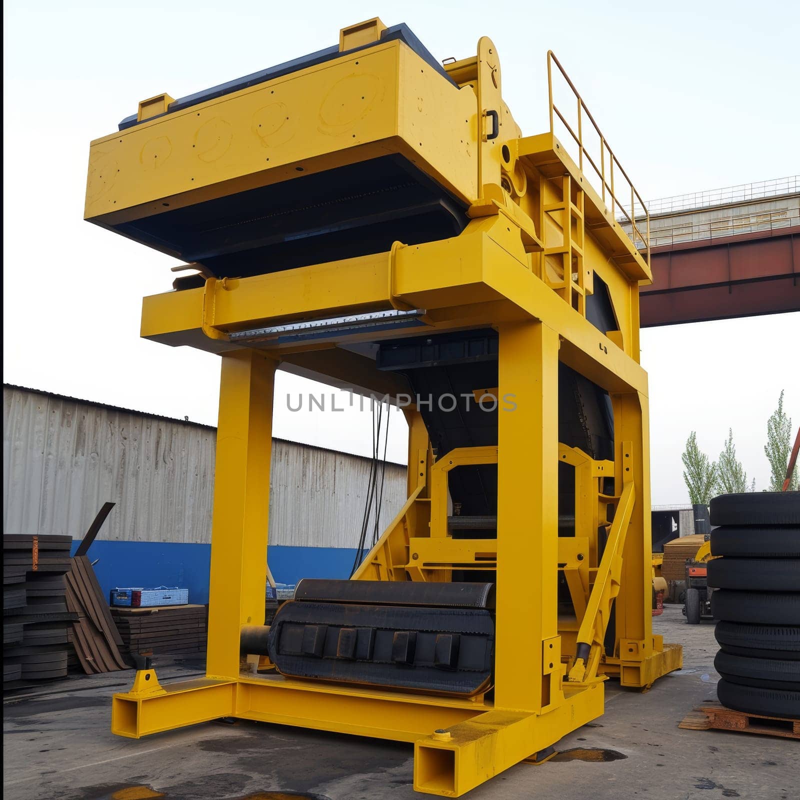 Large yellow industrial machine designed for heavy-duty pressing and manufacturing tasks. by sfinks