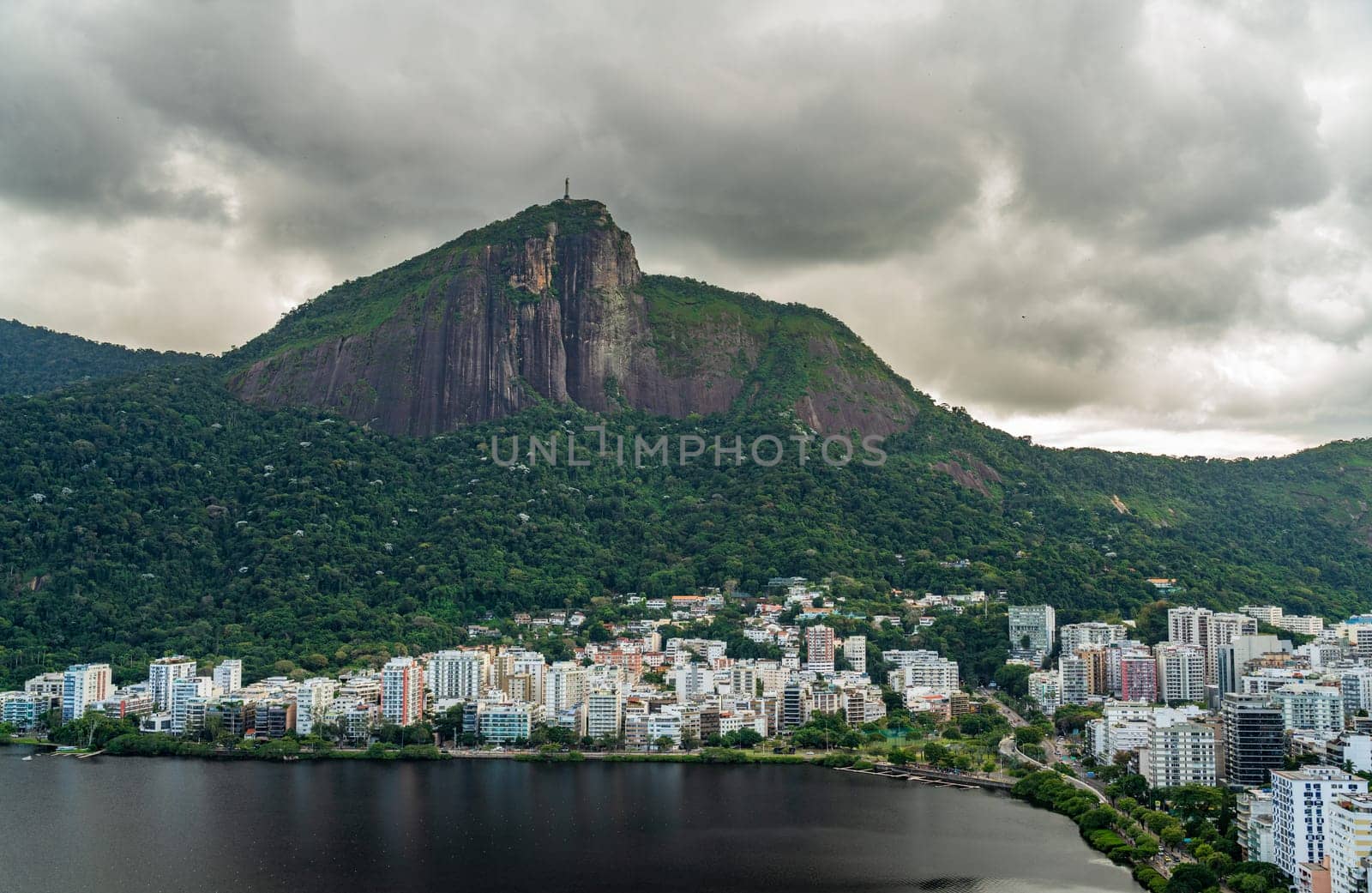 Christ the Redeemer overlooks Rio's homes among the dense jungle.