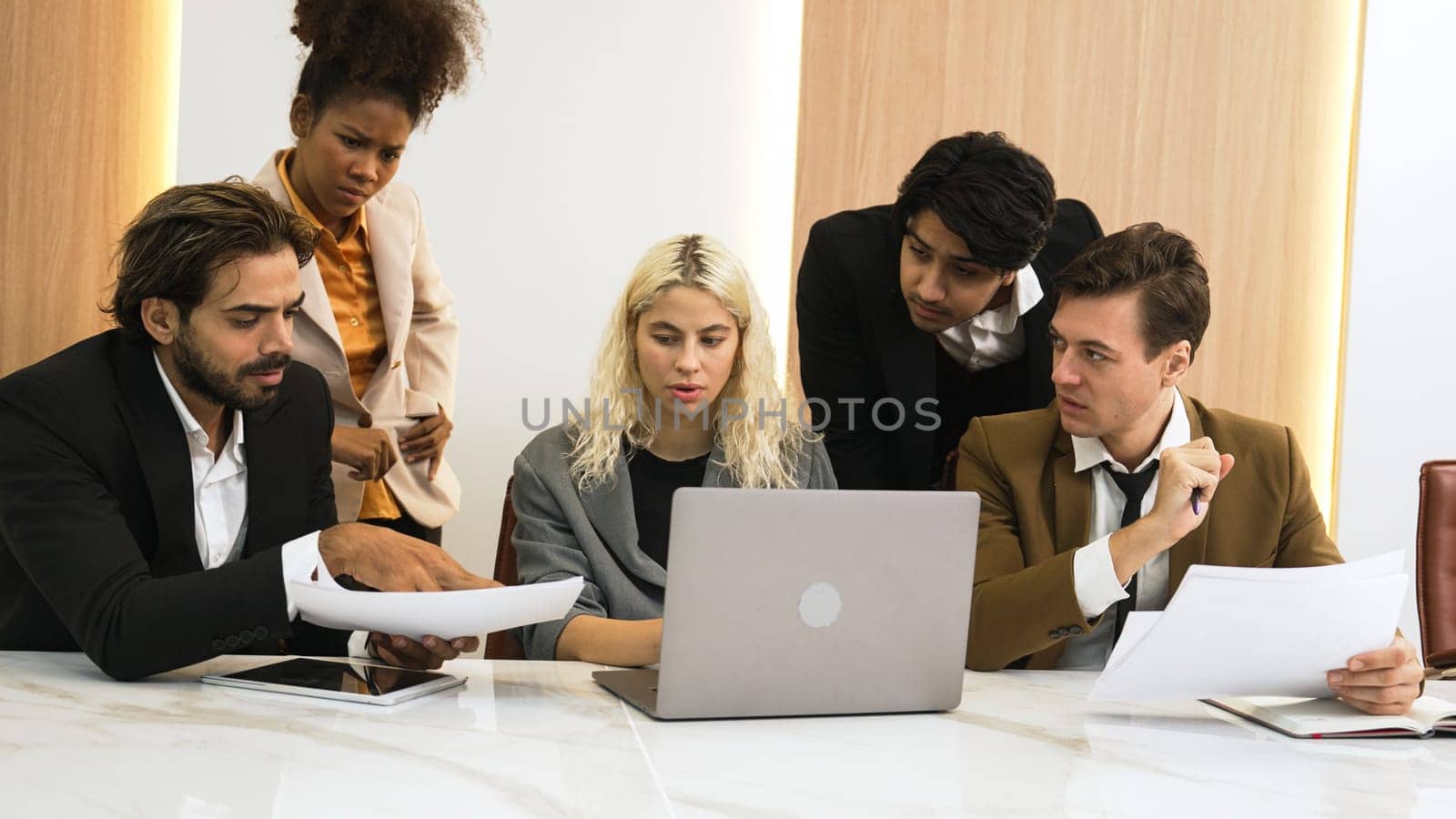 Diverse office worker employee working and brainstorm on strategic business marketing planning. Teamwork and positive attitude create productive and supportive in ornamented business office workplace.