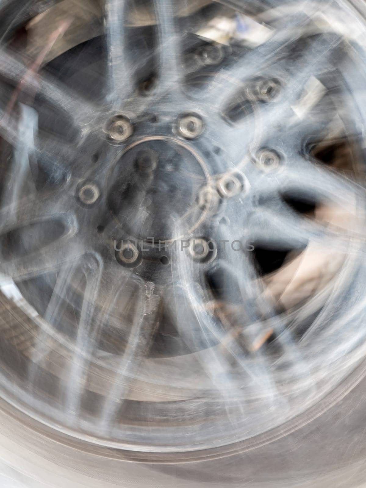The motion blurred image of the vehicle wheel by Satakorn