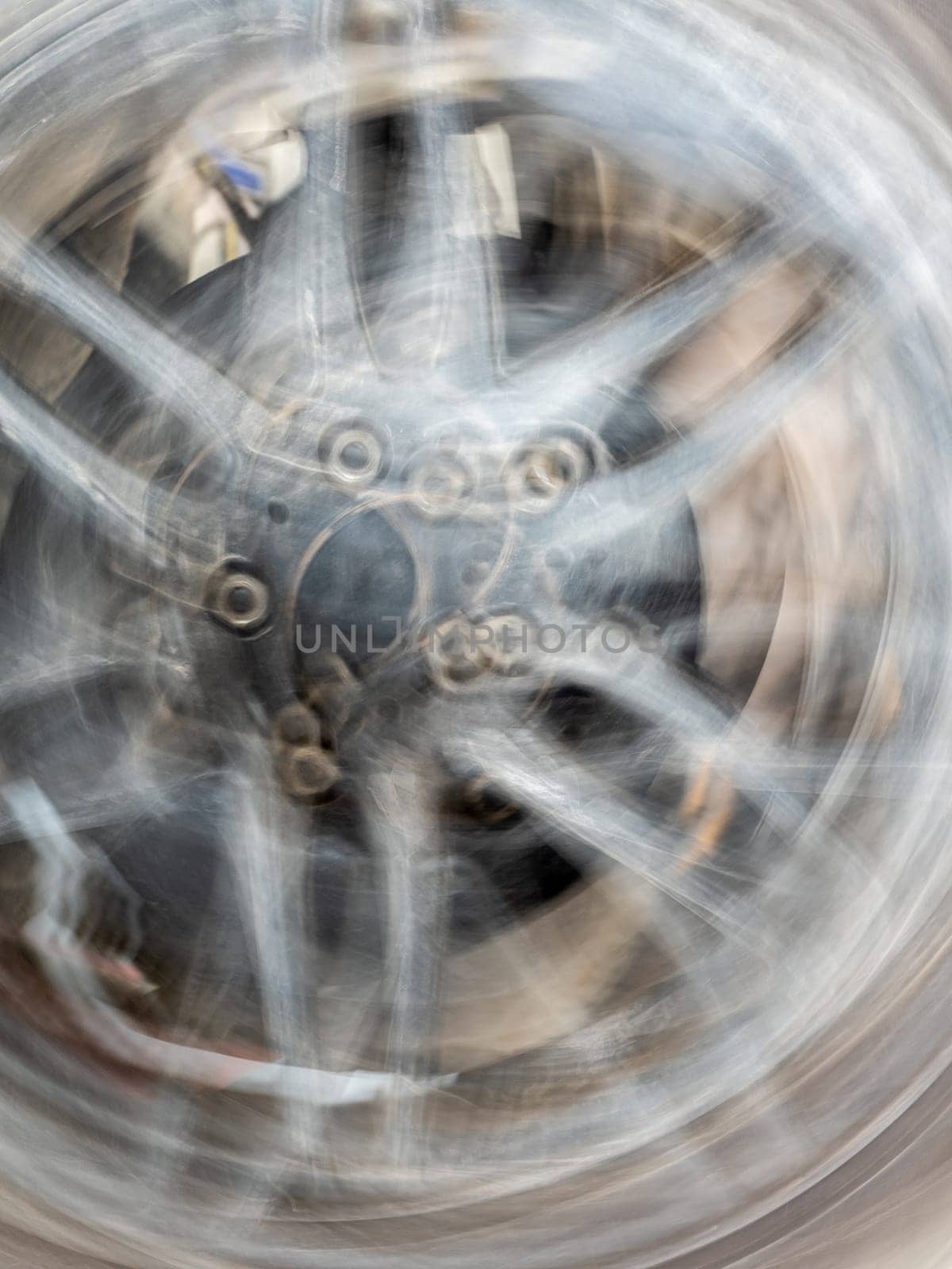 The motion blurred image of the vehicle wheel by Satakorn