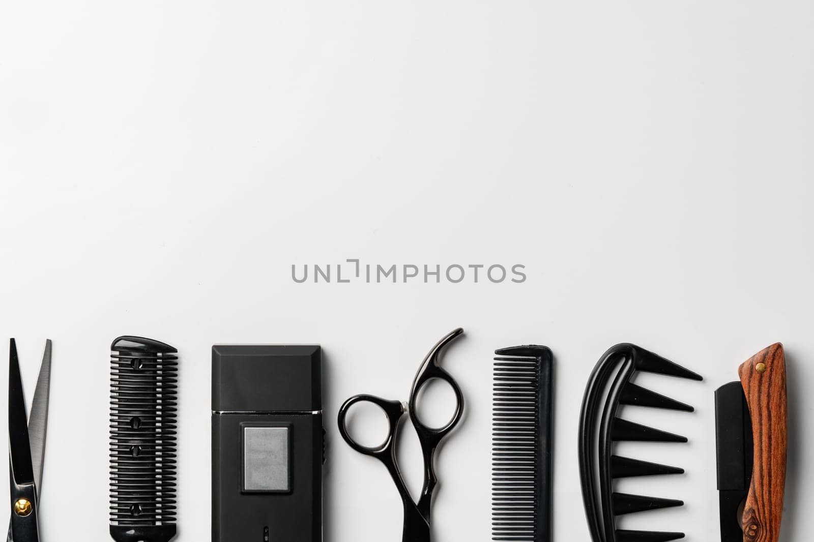 Set of barber tools for haircut on gray background flat lay by Fabrikasimf