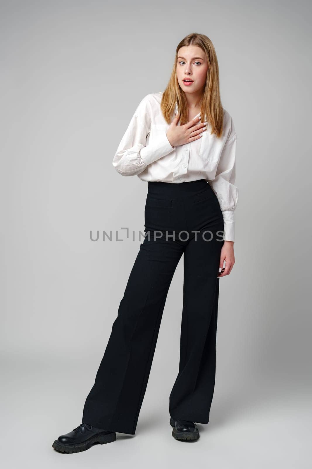 Young woman in a state of shock or surprise in studio