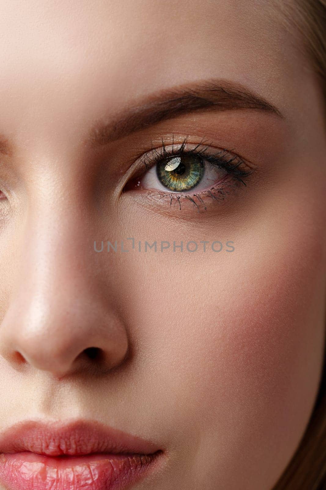 Close Up Portrait of Young Woman With Green Eyes