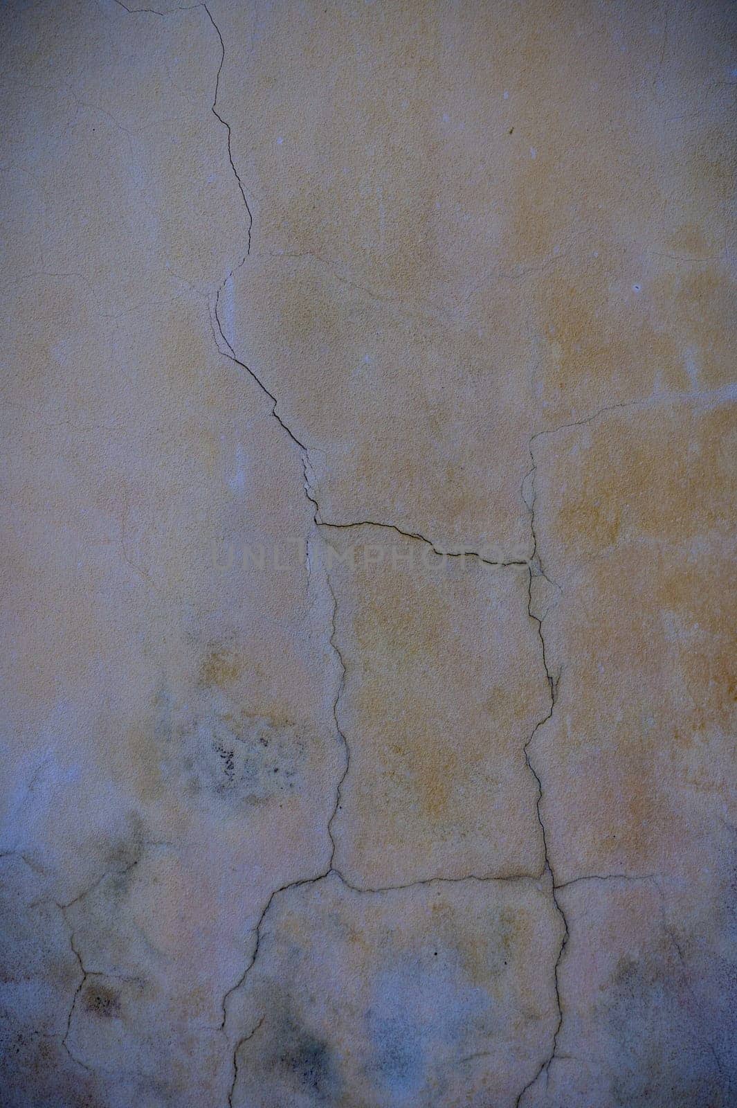 cracked concrete wall covered with gray cement surface as background