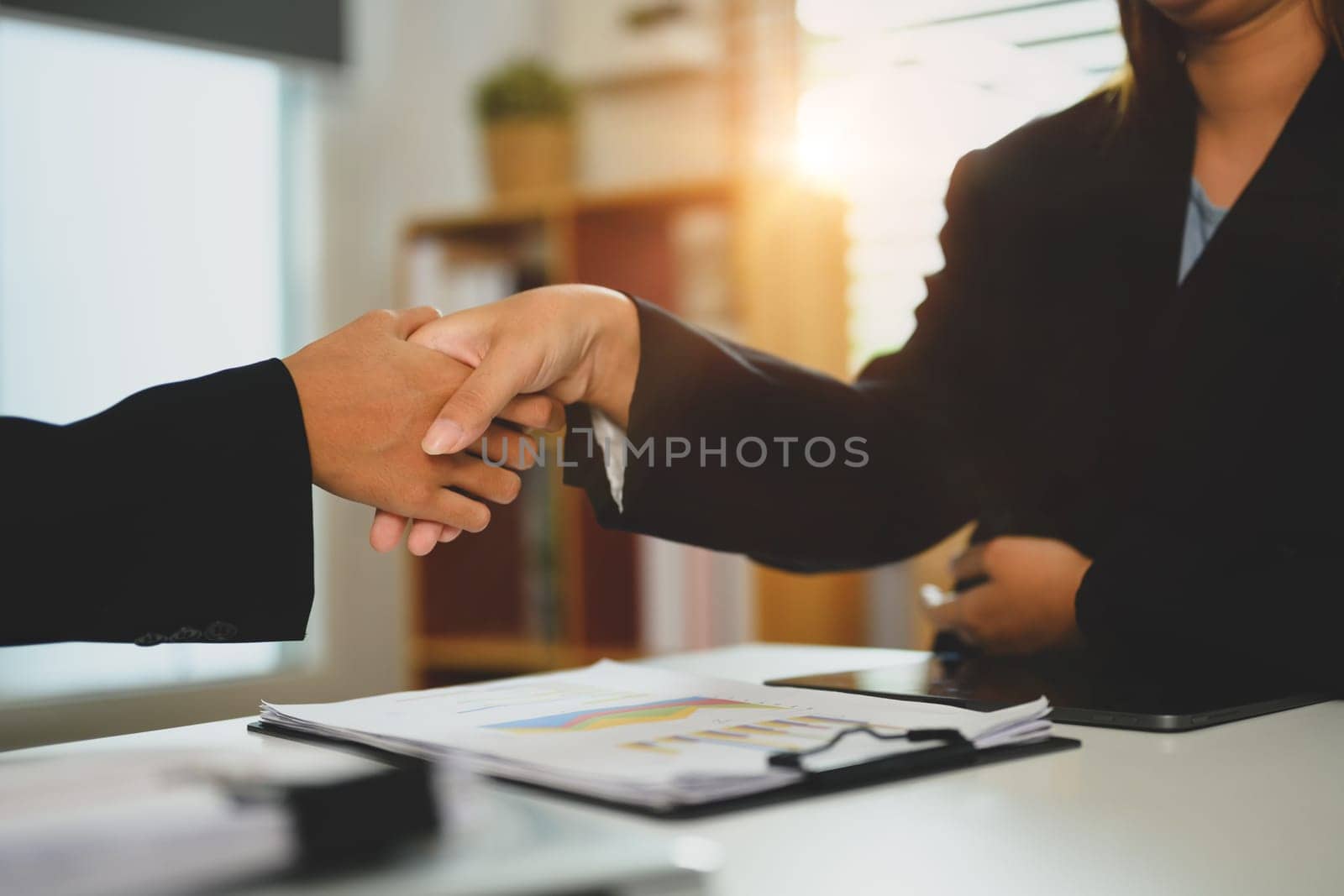 Cropped image of businesspeople shaking hands on business cooperation agreement.