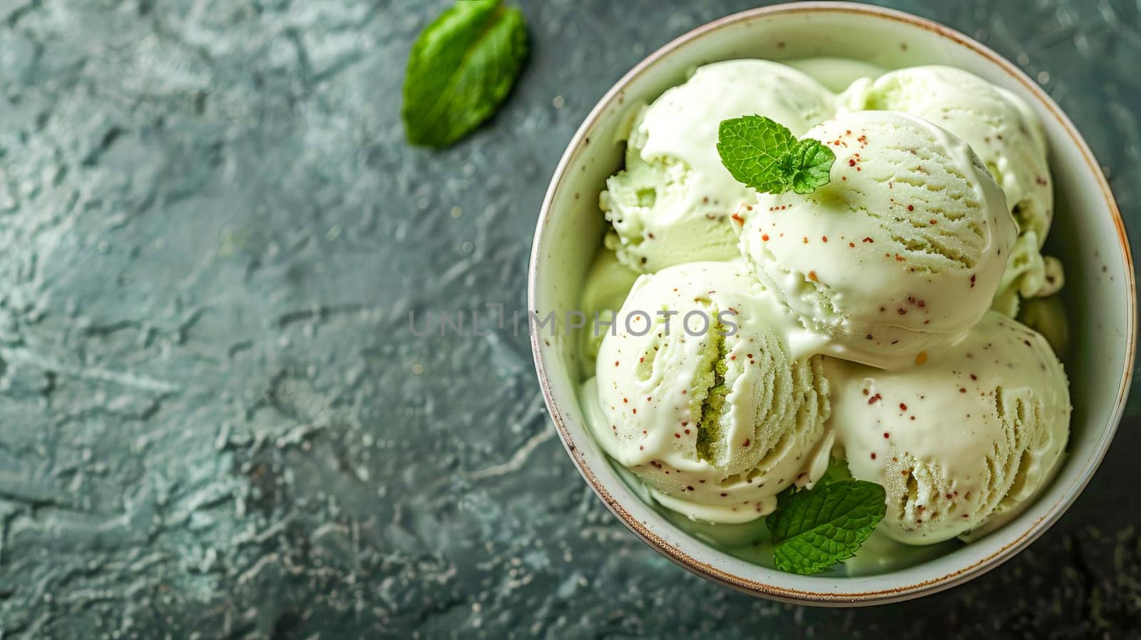 Creamy mint ice cream in an ice cream bowl with fresh mint leaves. AI generated. by OlgaGubskaya