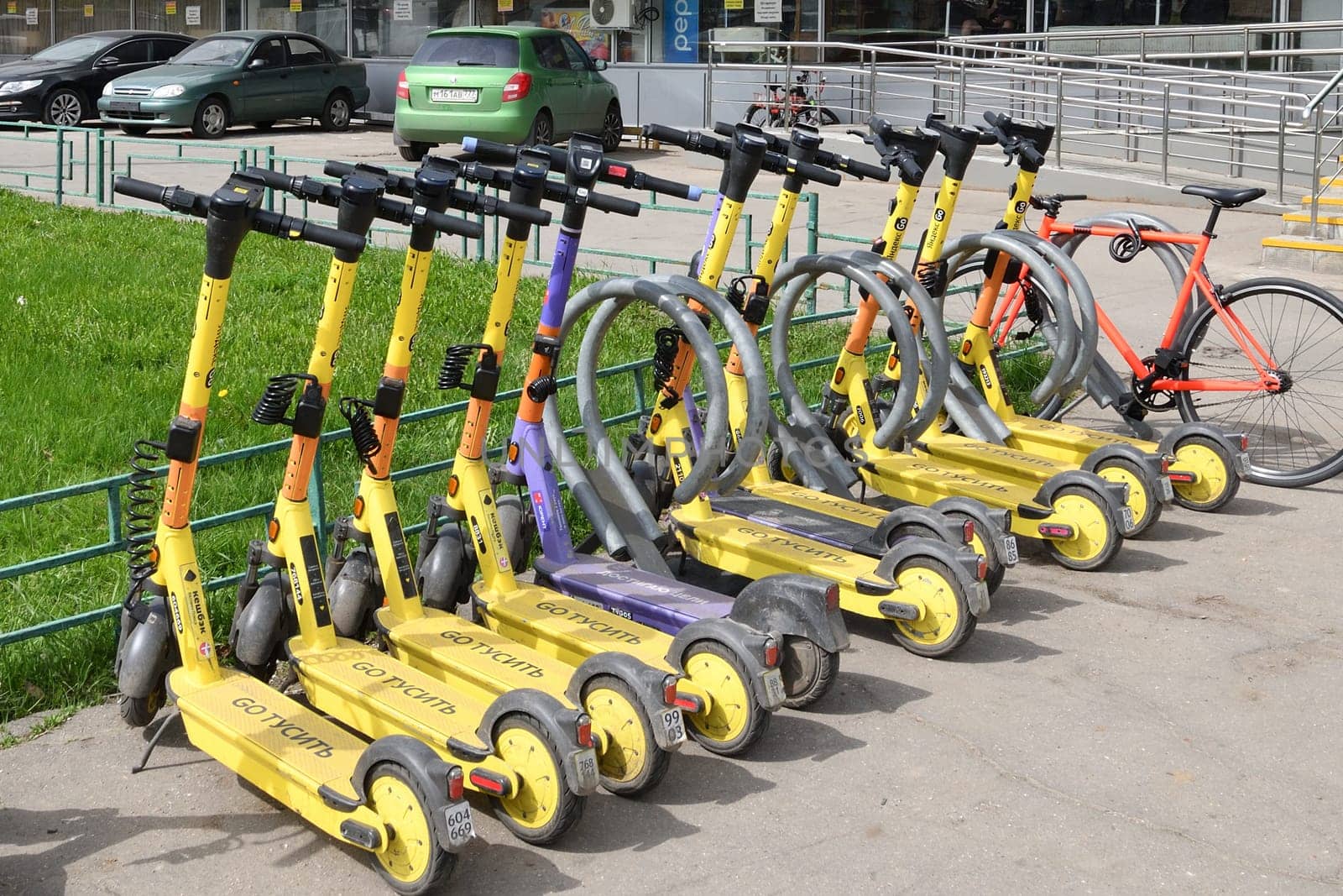 Moscow, Russia - Apr 26. 2024. Short-term rental service for electric scooters Yandex Go and Urent in Zelenograd by olgavolodina