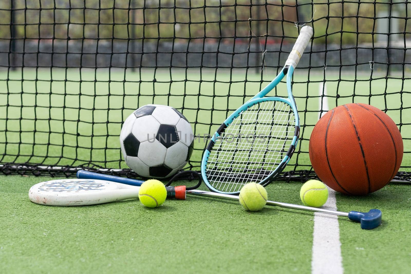 Set of sport equipment on green grass. High quality photo