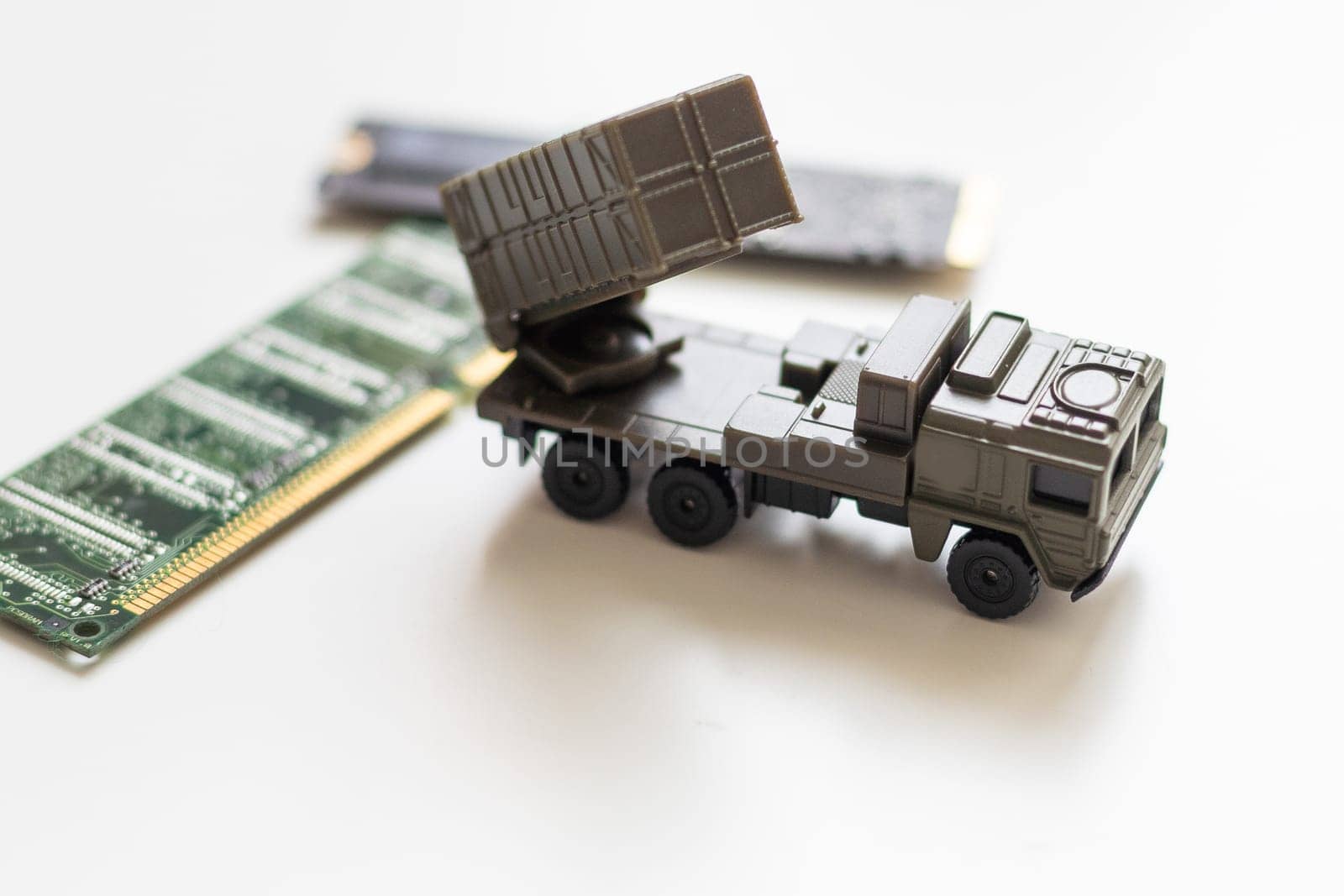 A toy military vehicle with a rocket and microcircuit. High quality photo