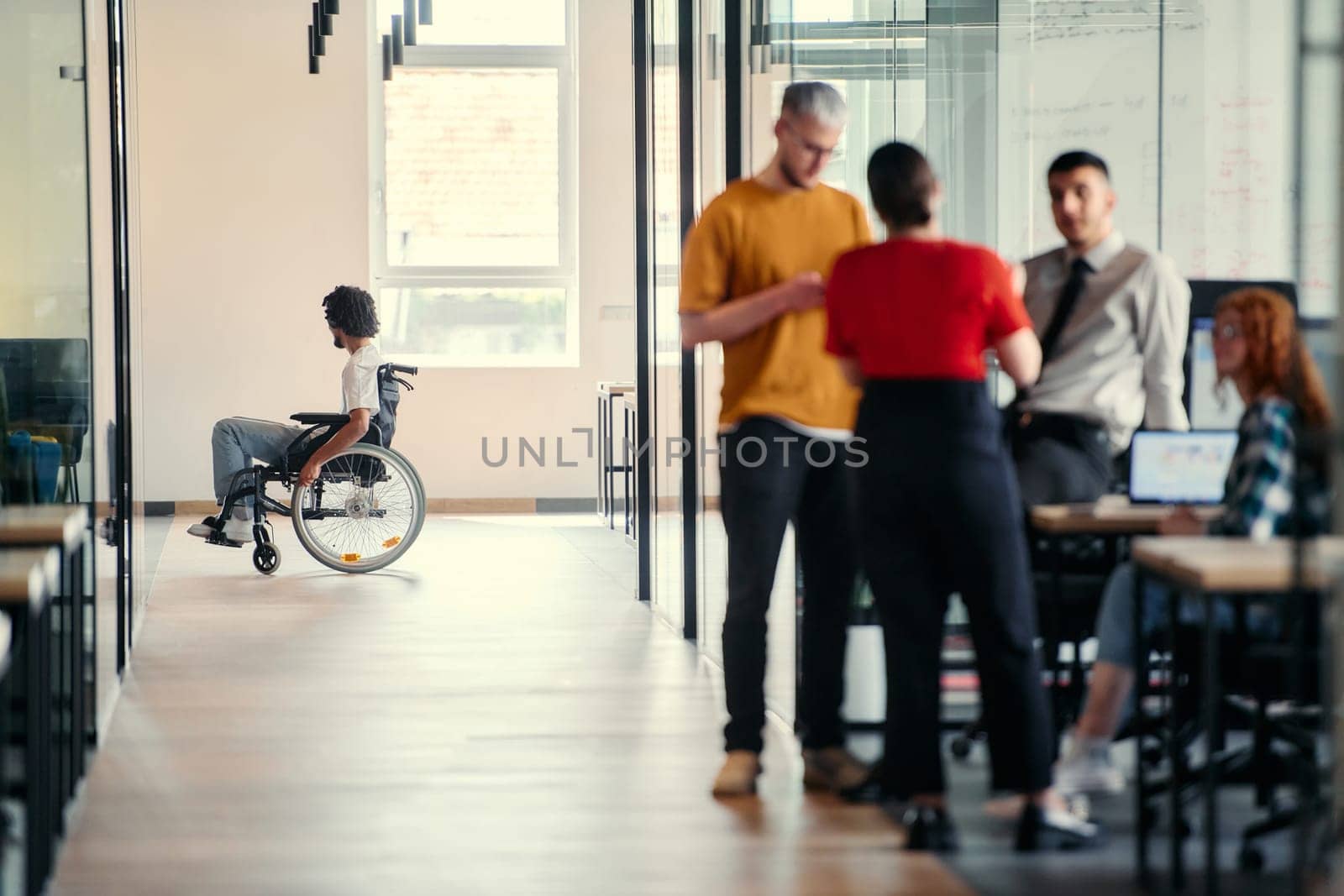 A dynamic group of young entrepreneurs engages in vibrant discussion within a modern glass office space, exploring new business projects and fostering innovation.