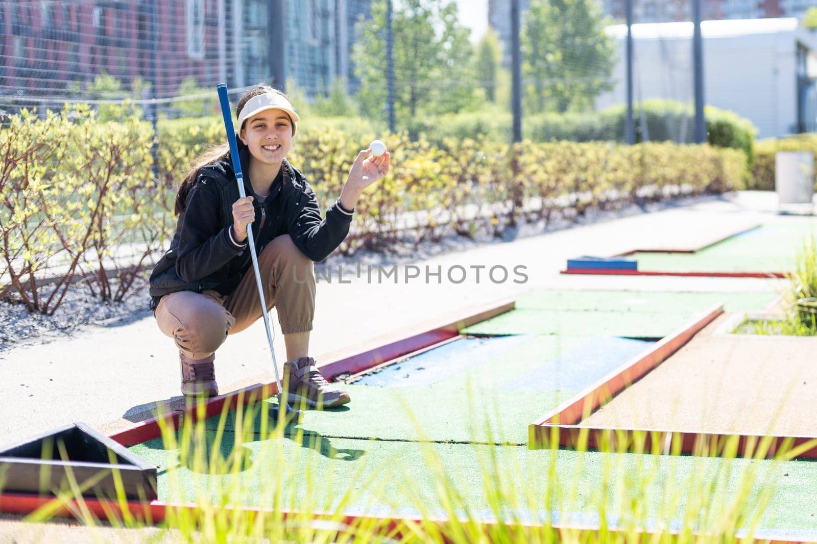 Mini-golf ball on artificial grass. Summer season game. High quality photo
