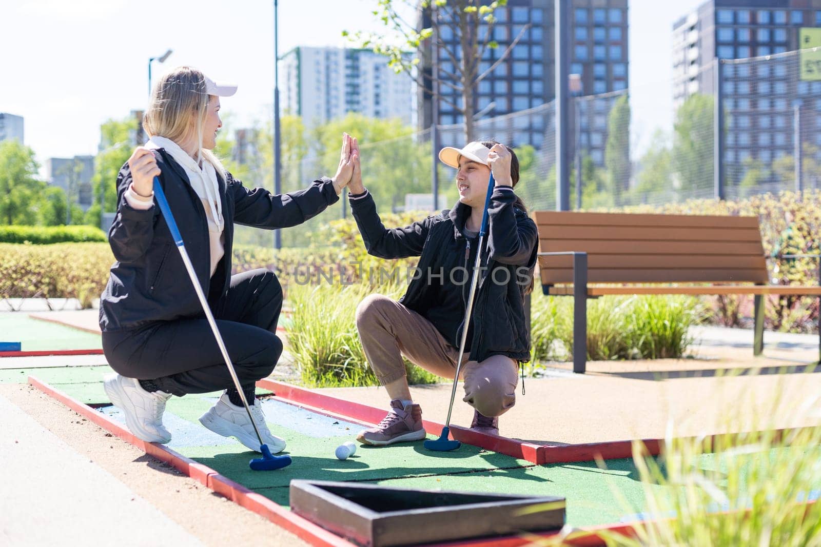 Mini-golf ball on artificial grass. Summer season game by Andelov13