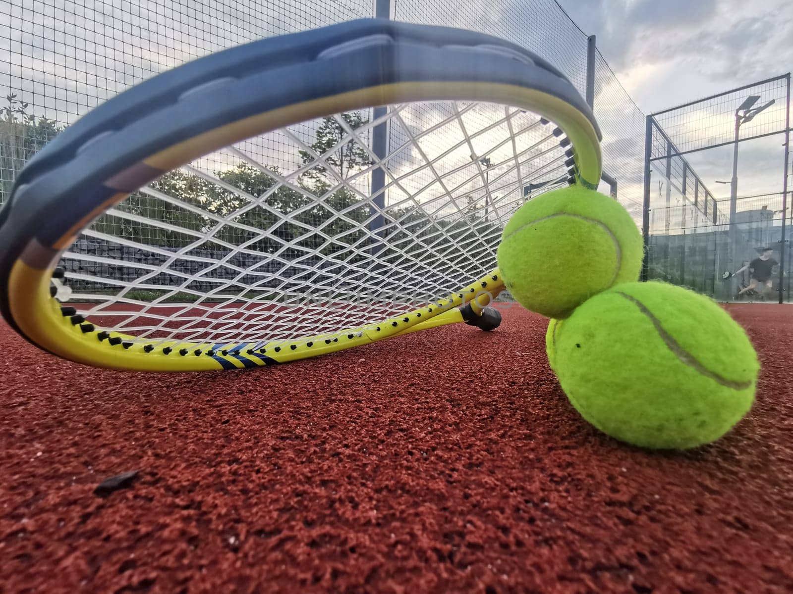 yellow tennis balls and racquet on hard tennis court surface, top view tennis scene by Andelov13