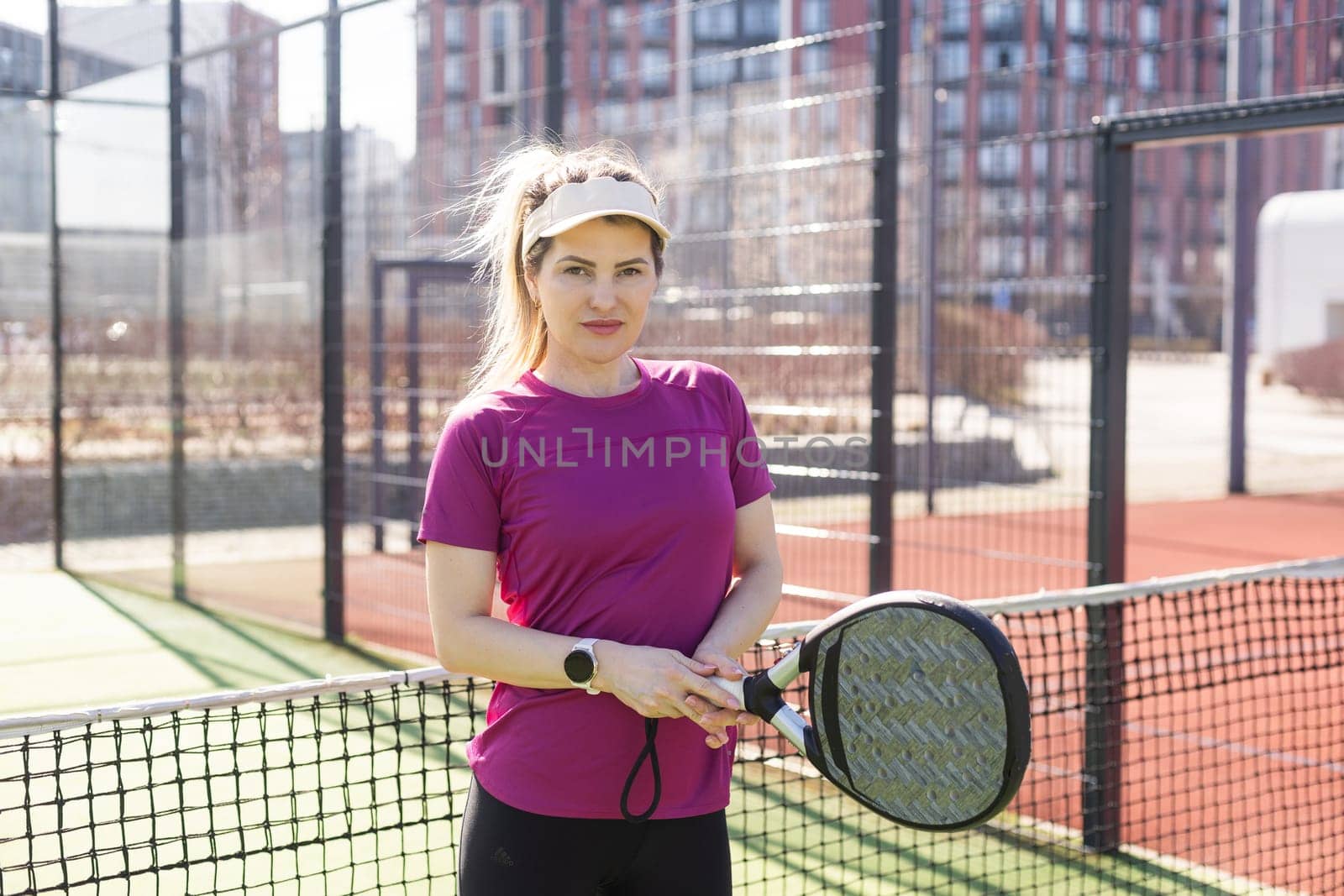One women playing Paddle tennis. High quality photo