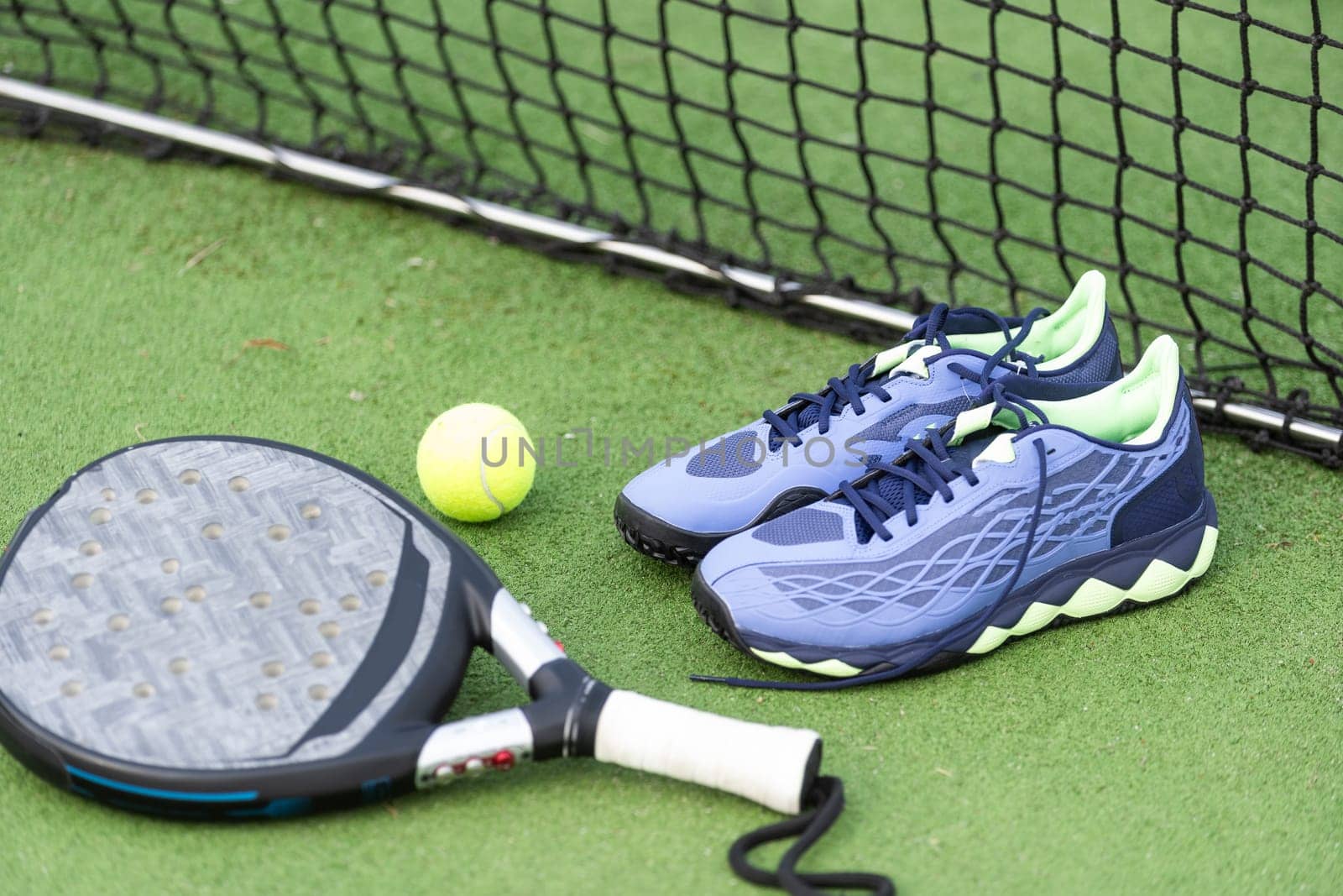 Paddle tennis objects and court. High quality photo