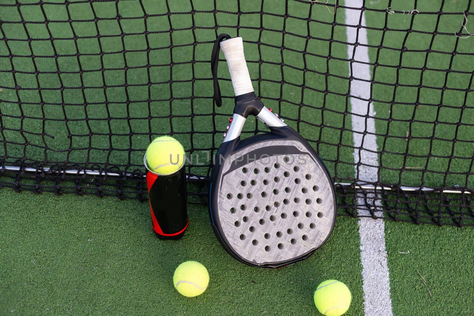 Paddle tennis objects on grass court. High quality photo