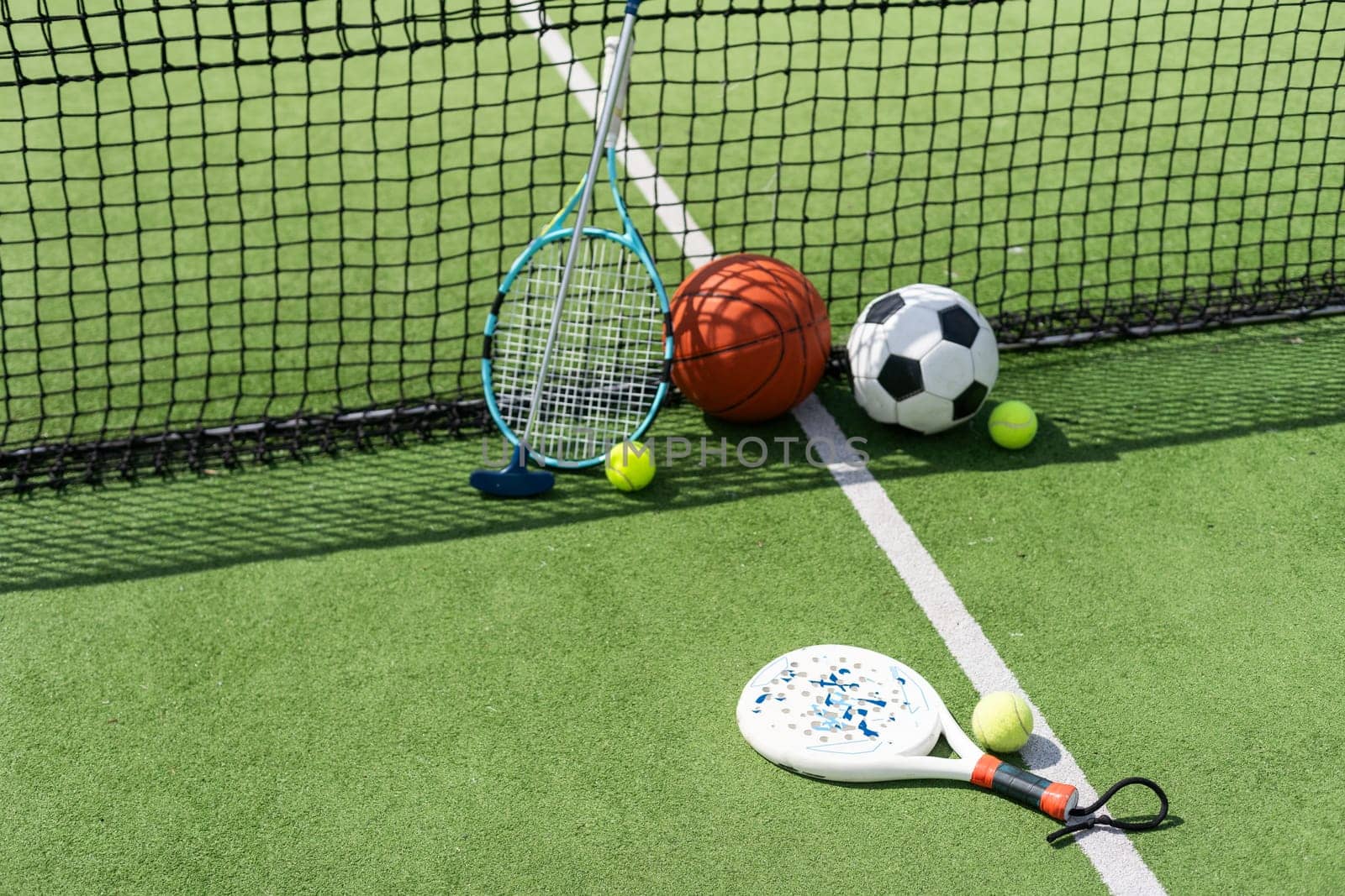 Set of sport equipment on green grass. High quality photo