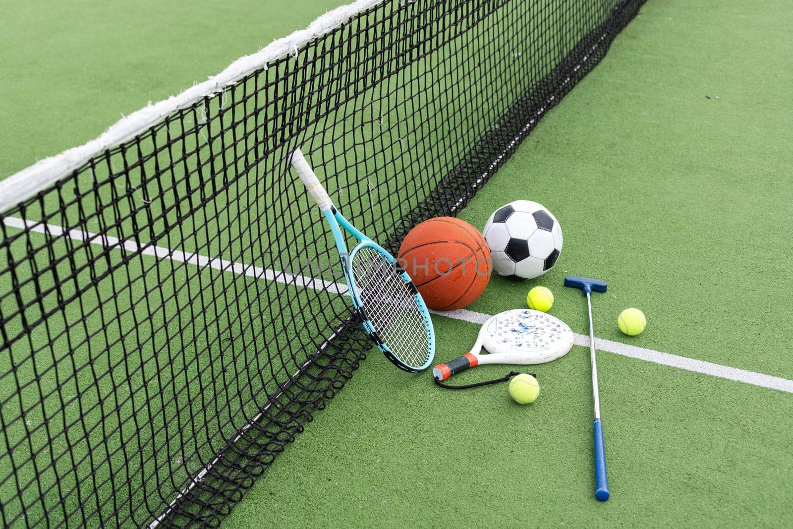Set of sport equipment on green grass. High quality photo