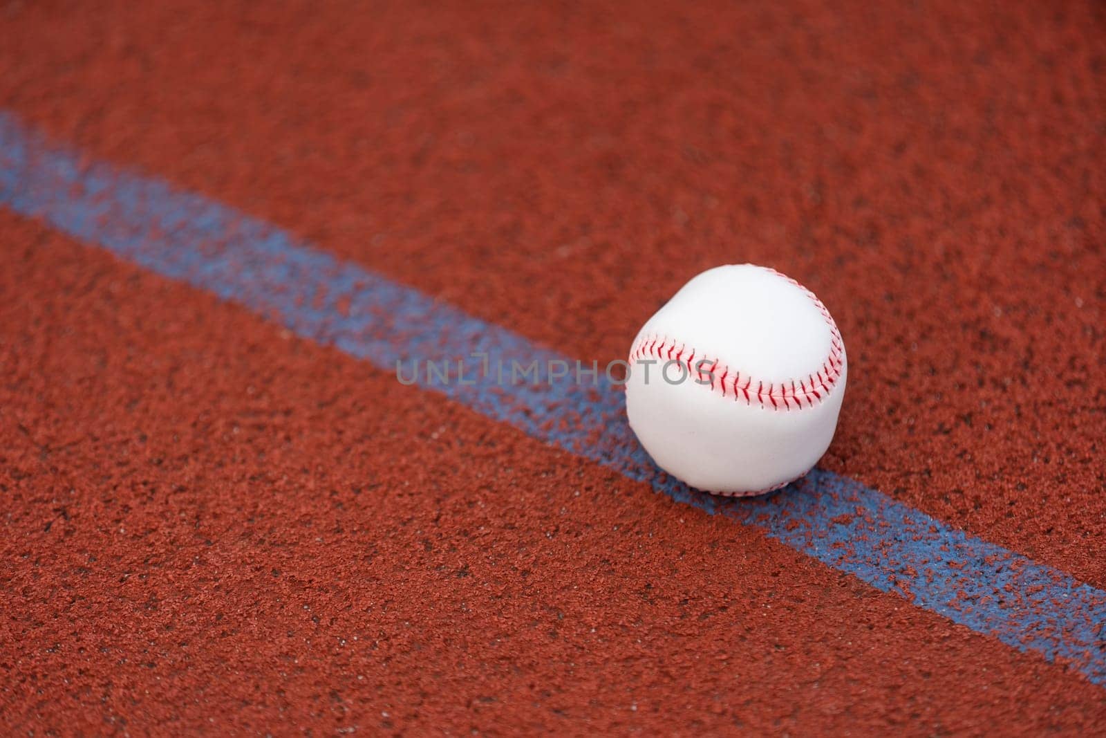 one baseball on infield of sport field by Andelov13