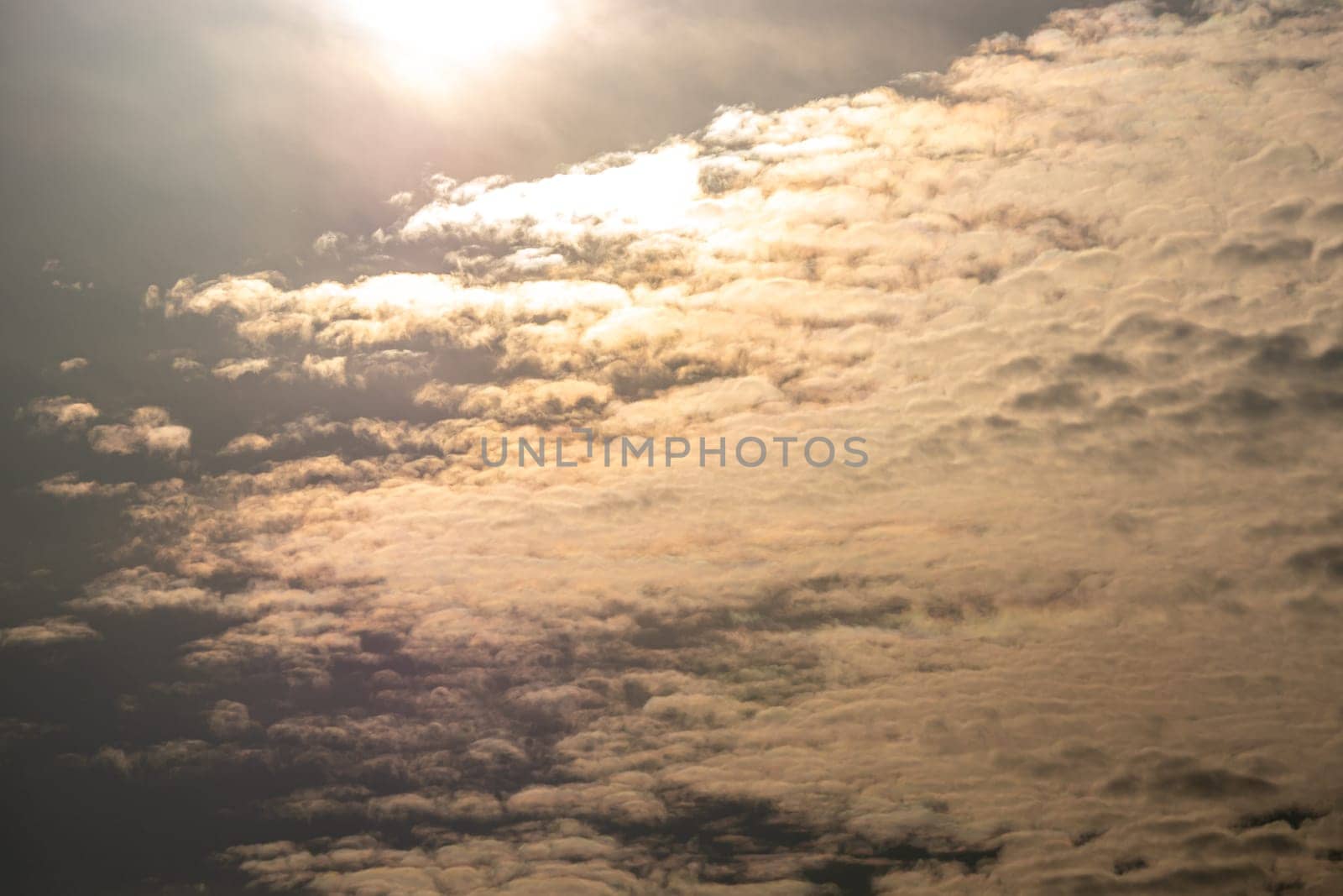 Fluffy clouds floating scattered across the sky by Satakorn