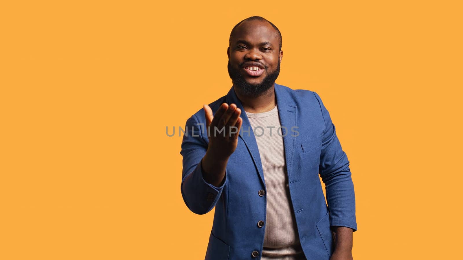 Frisky playful african american man blowing kisses to camera, being flirty. Lively charming BIPOC person having fun sending air kisses, doing romantic gesturing, studio background, camera B