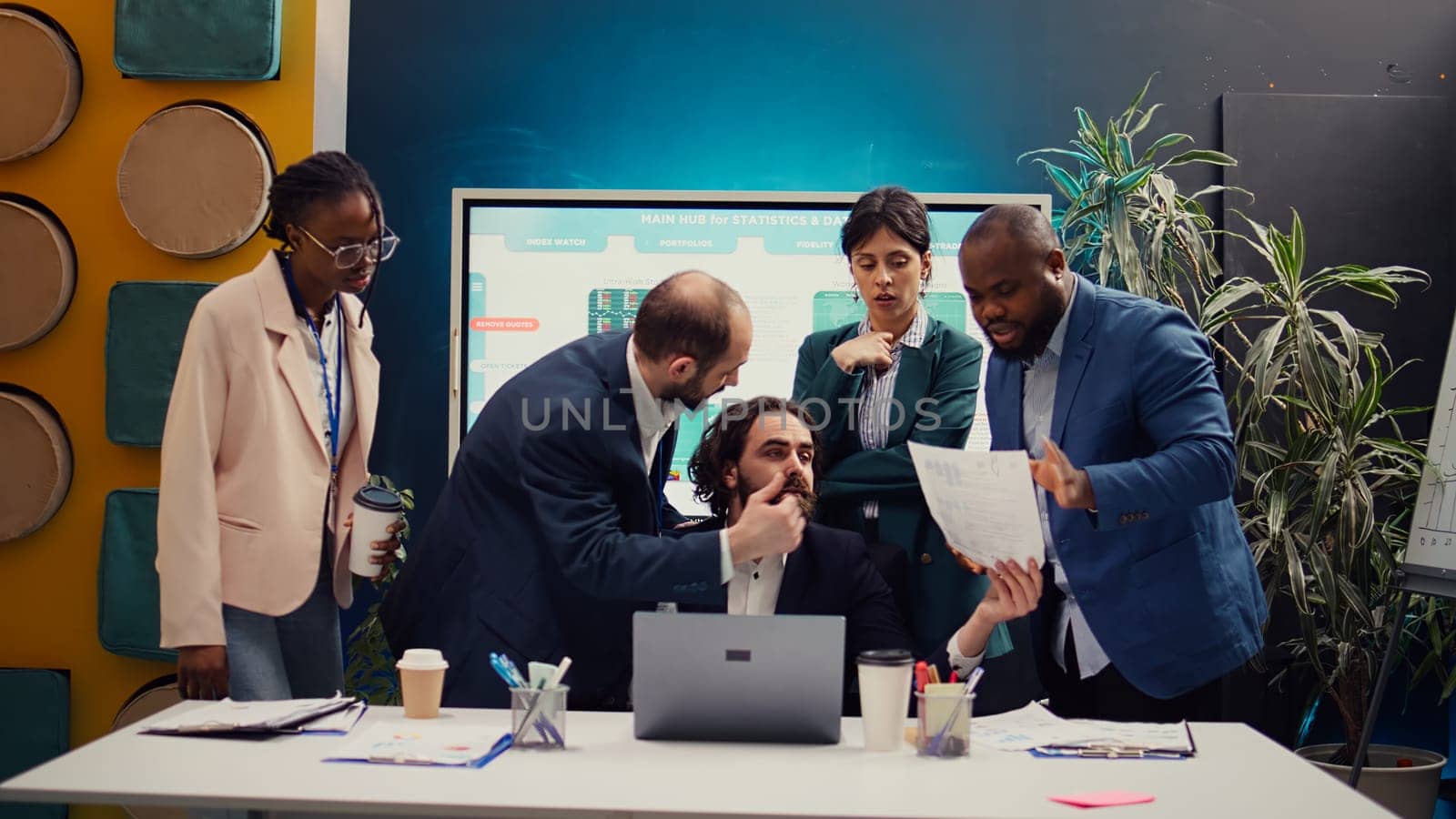 Research team presenting all insight and statistics data they found online, briefing their manager about the work progress and achievements. Employees showing gathered info. Camera B.