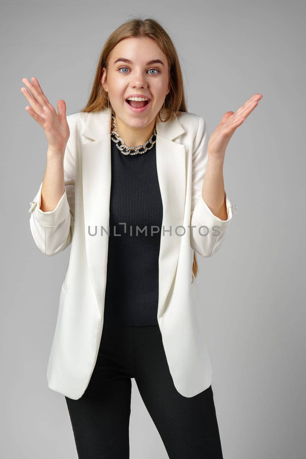 Excited Young Woman in Stylish Outfit Surprised Expression by Fabrikasimf