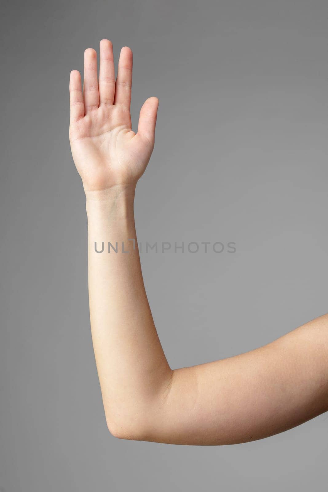 Woman Holding Arm Up in the Air with Gesture close up