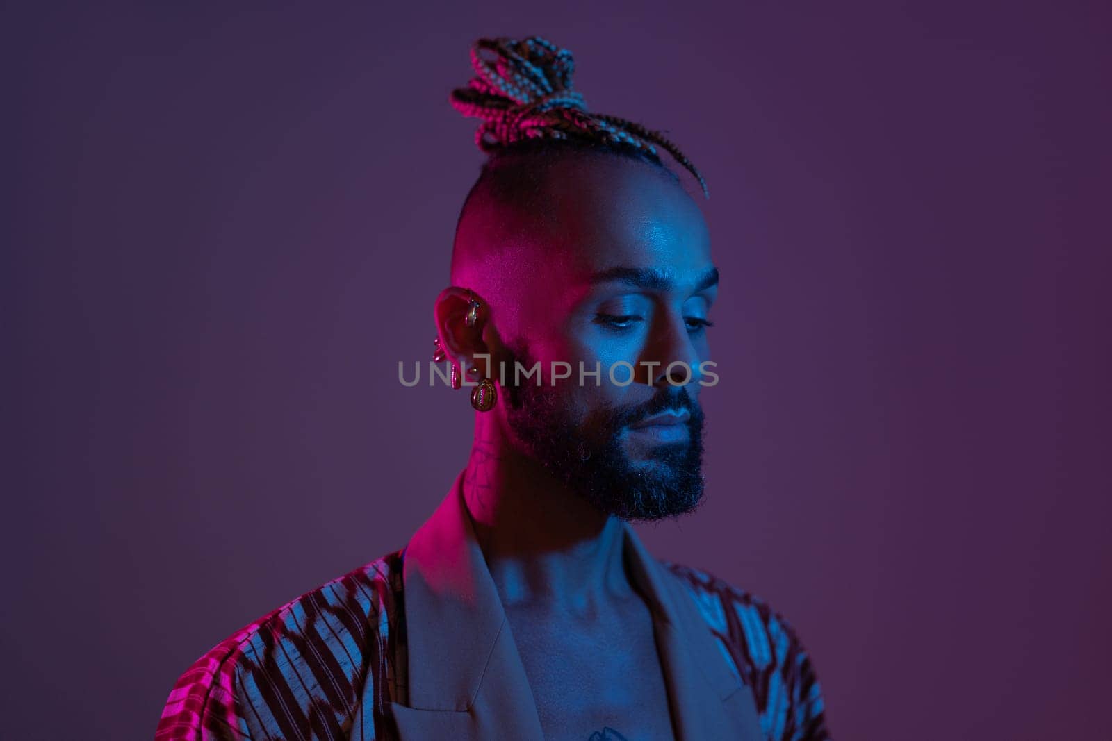 Black man in neon studio light by andreonegin