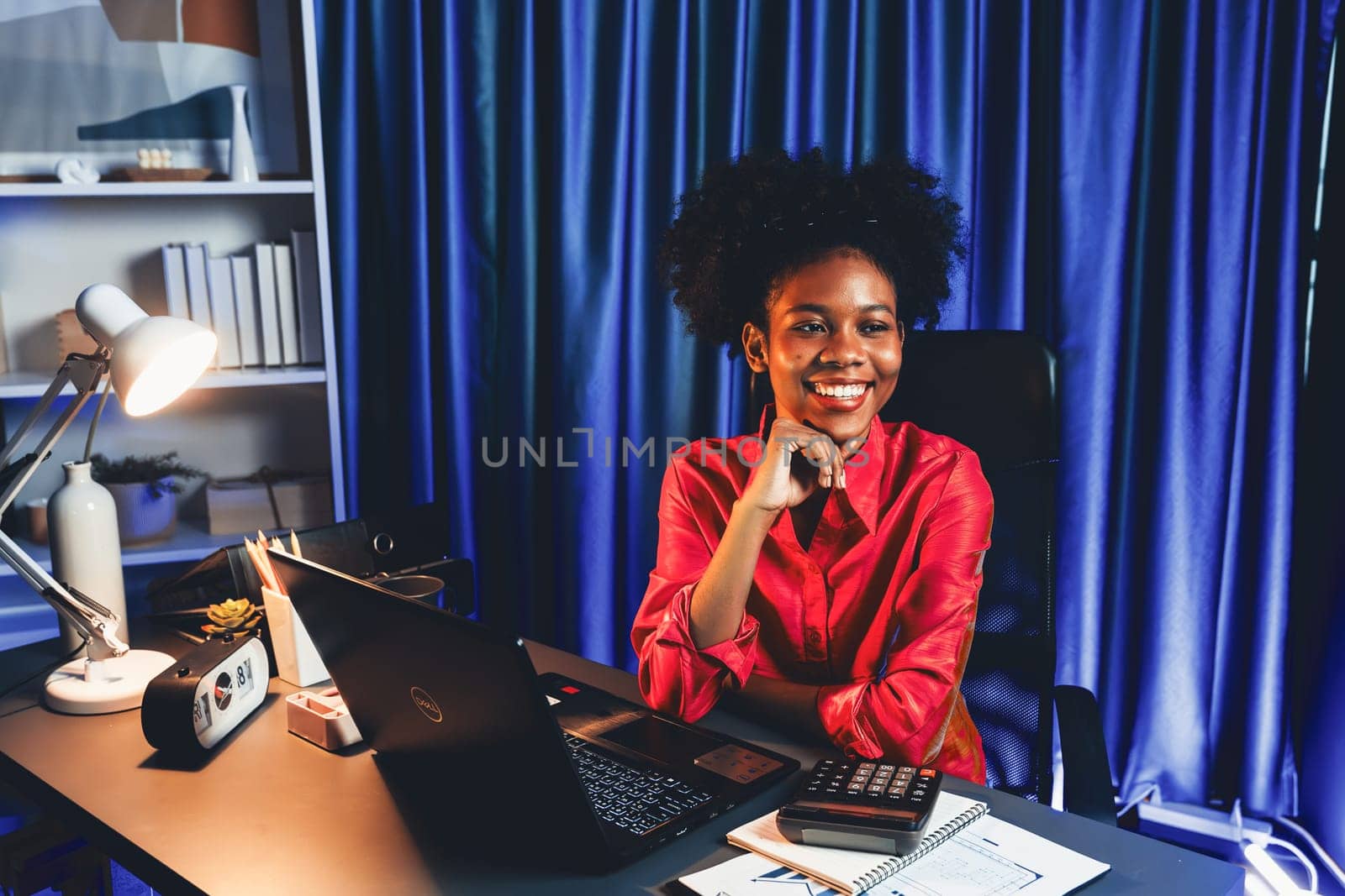 Working African woman with happy glowing, smiling face, getting new job project with good deal or marketing course scholarship information on laptop screen. Concept of cheerful expression. Tastemaker.