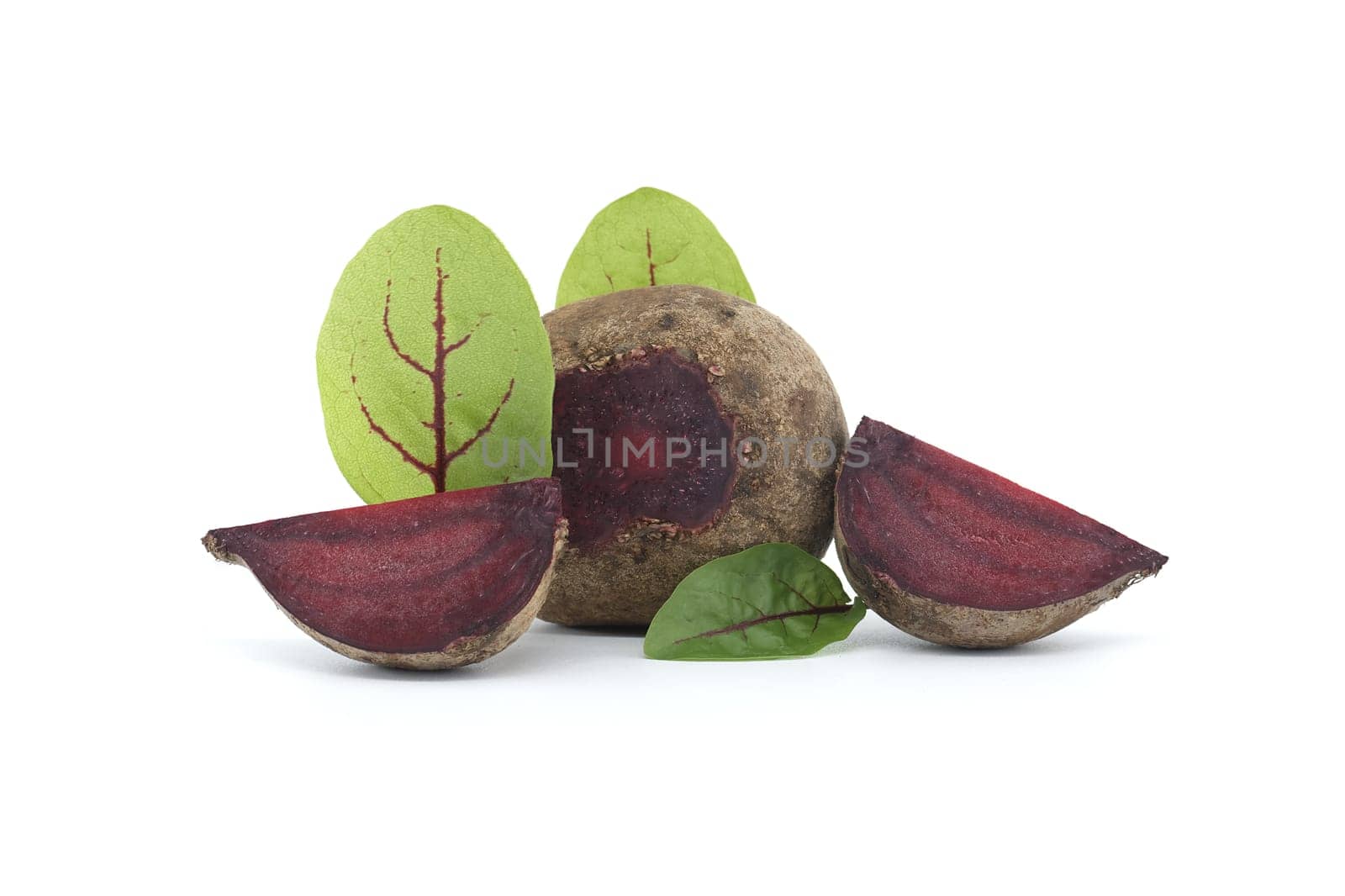 Slices of beetroot, revealing their vibrant purple interiors, are neatly arranged beside whole beetroot vegetables, complete with their fresh green leaves, all set against an isolated white background