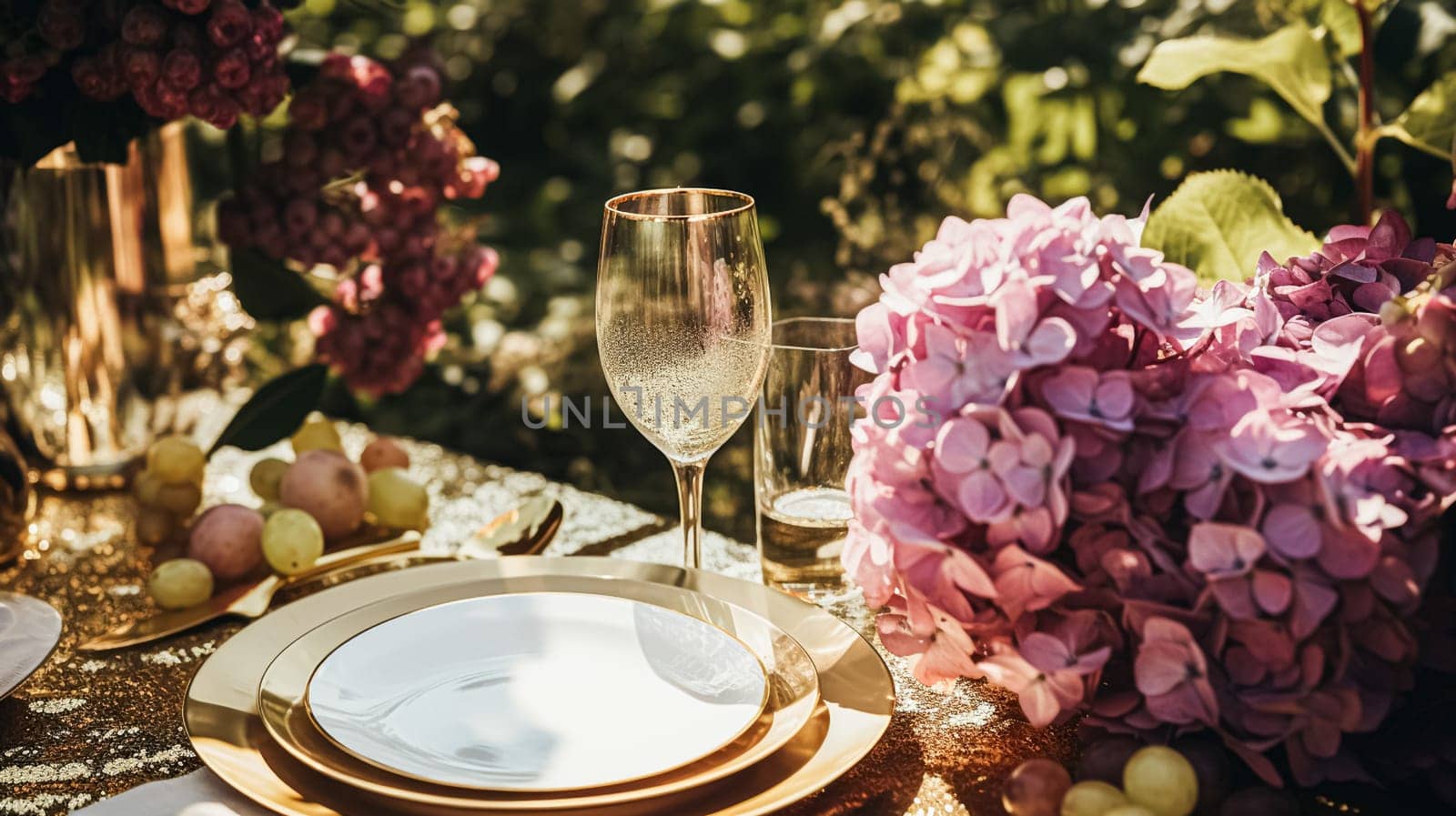Wedding or formal dinner holiday celebration tablescape with hydrangea flowers in the English countryside garden, table setting and wine, floral table decor for family dinner party, home styling inspiration