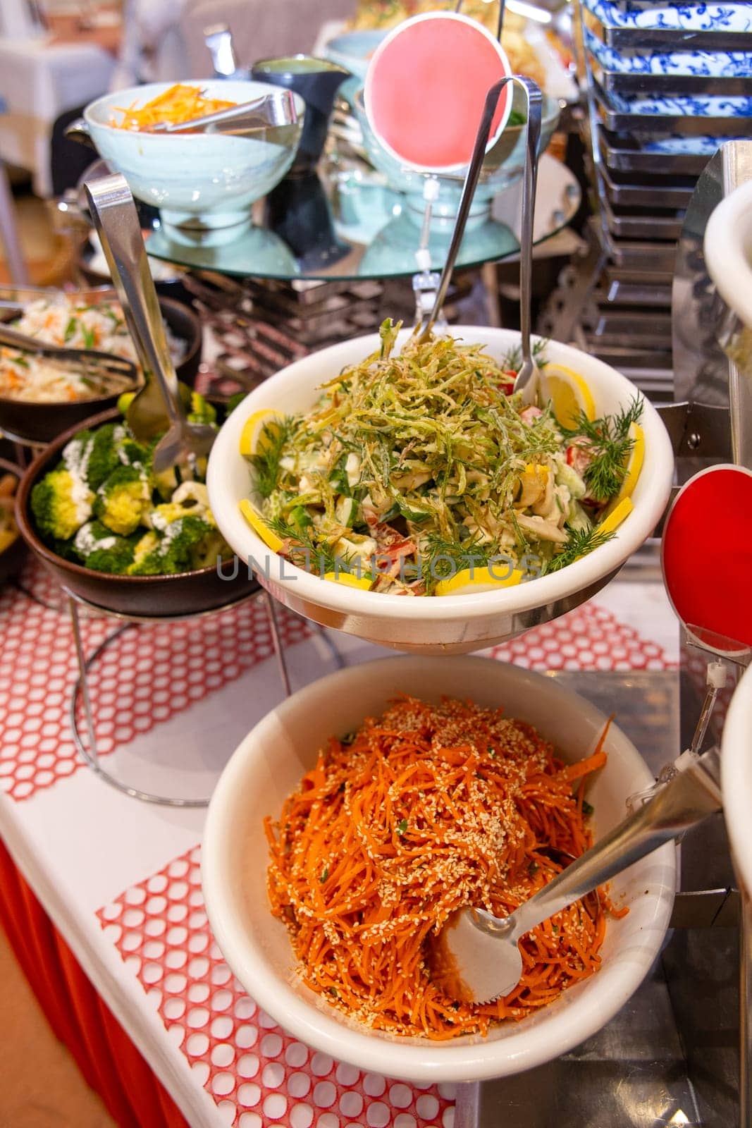 spicy salads of the cafe on the buffet table by Pukhovskiy