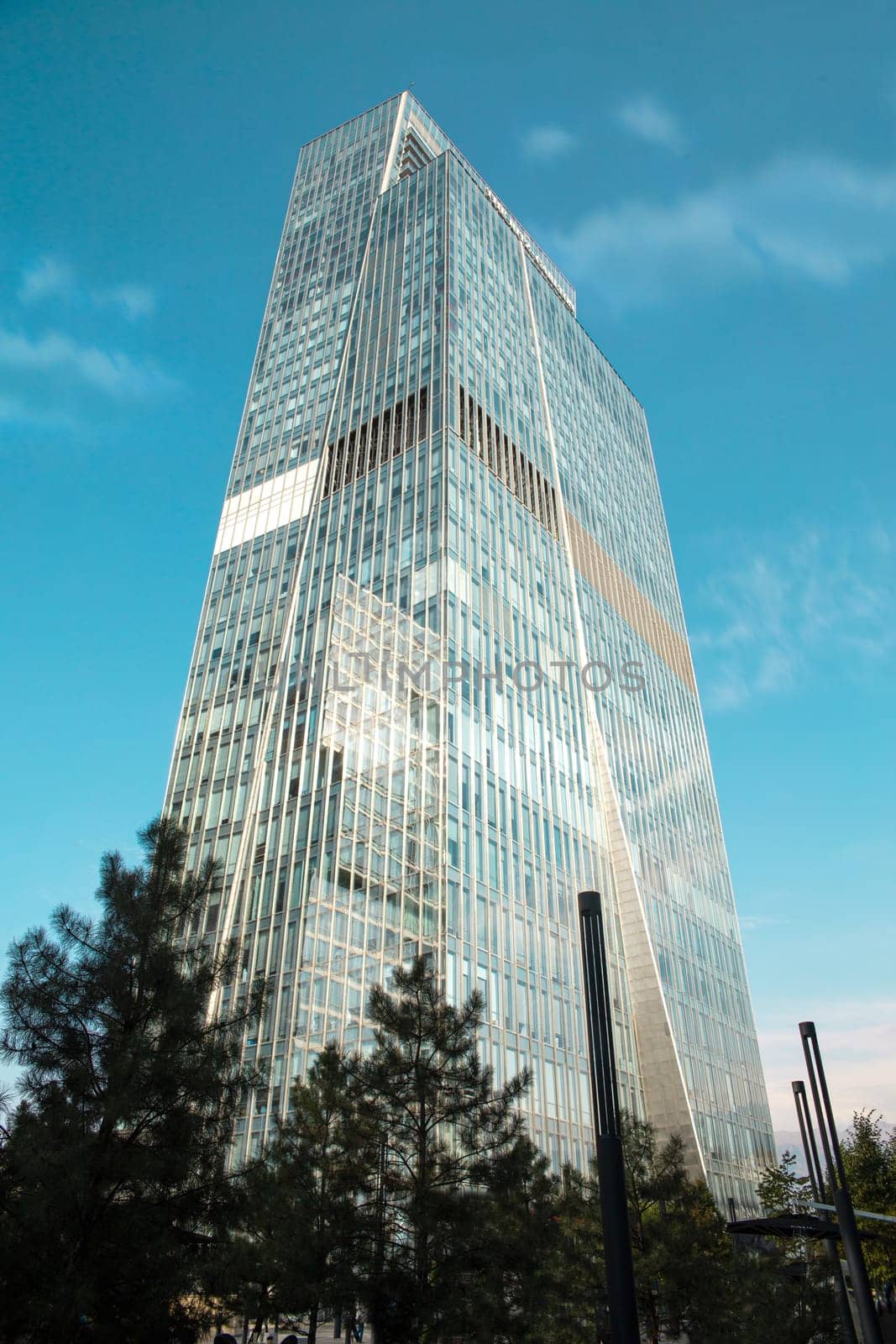 glass skyscraper in the city on a summer day.