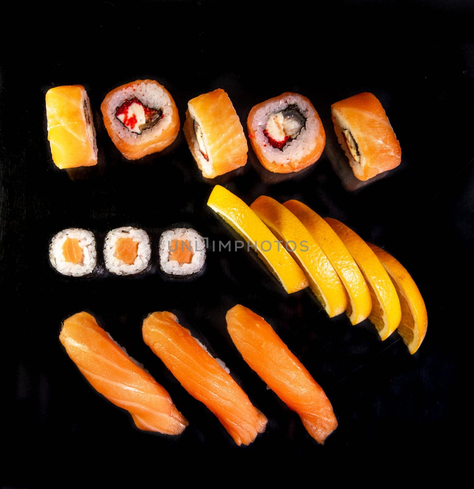 orange set of Japanese cuisine in a sushi bar by Pukhovskiy