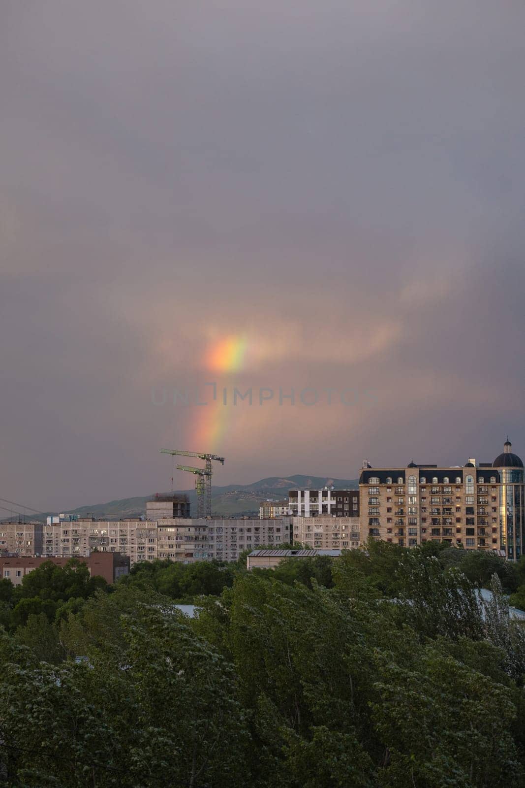 rainbow after rain on a summer day view from the window by Pukhovskiy